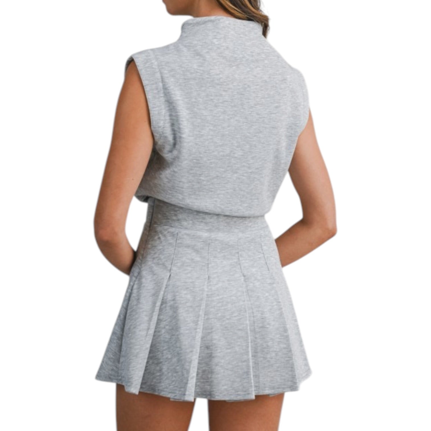 Gray sleeveless top and pleated skirt set on a white background