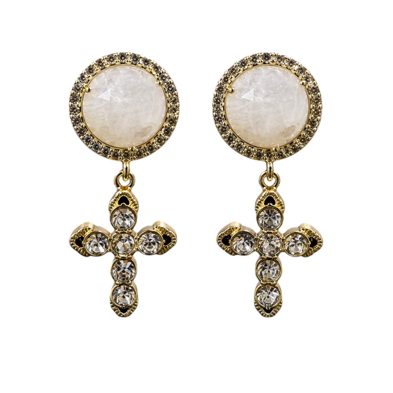 A pair of gold-toned drop earrings featuring round milky white stone studs surrounded by small dark stones, with matching gold cross pendants set with clear rhinestones, shown on a plain white background.