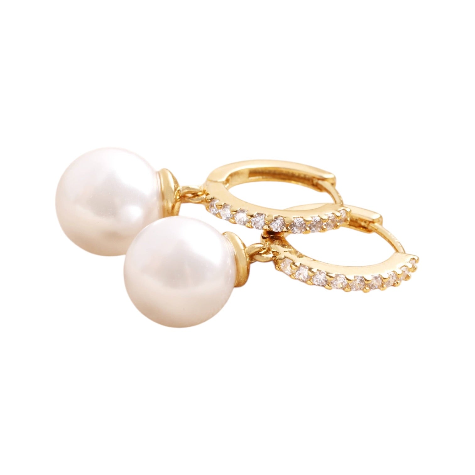 Gold hoop earrings with pearl drops on a white background