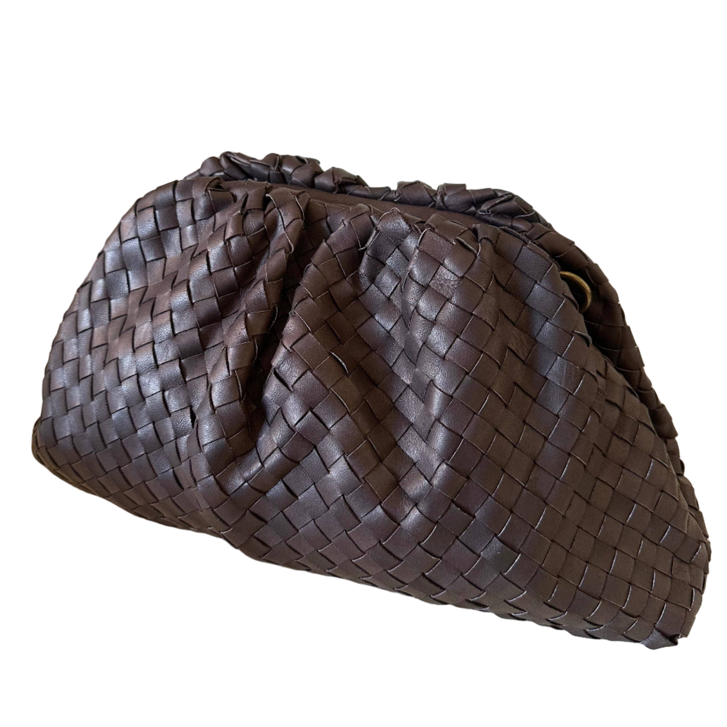 Brown woven handbag on a white background