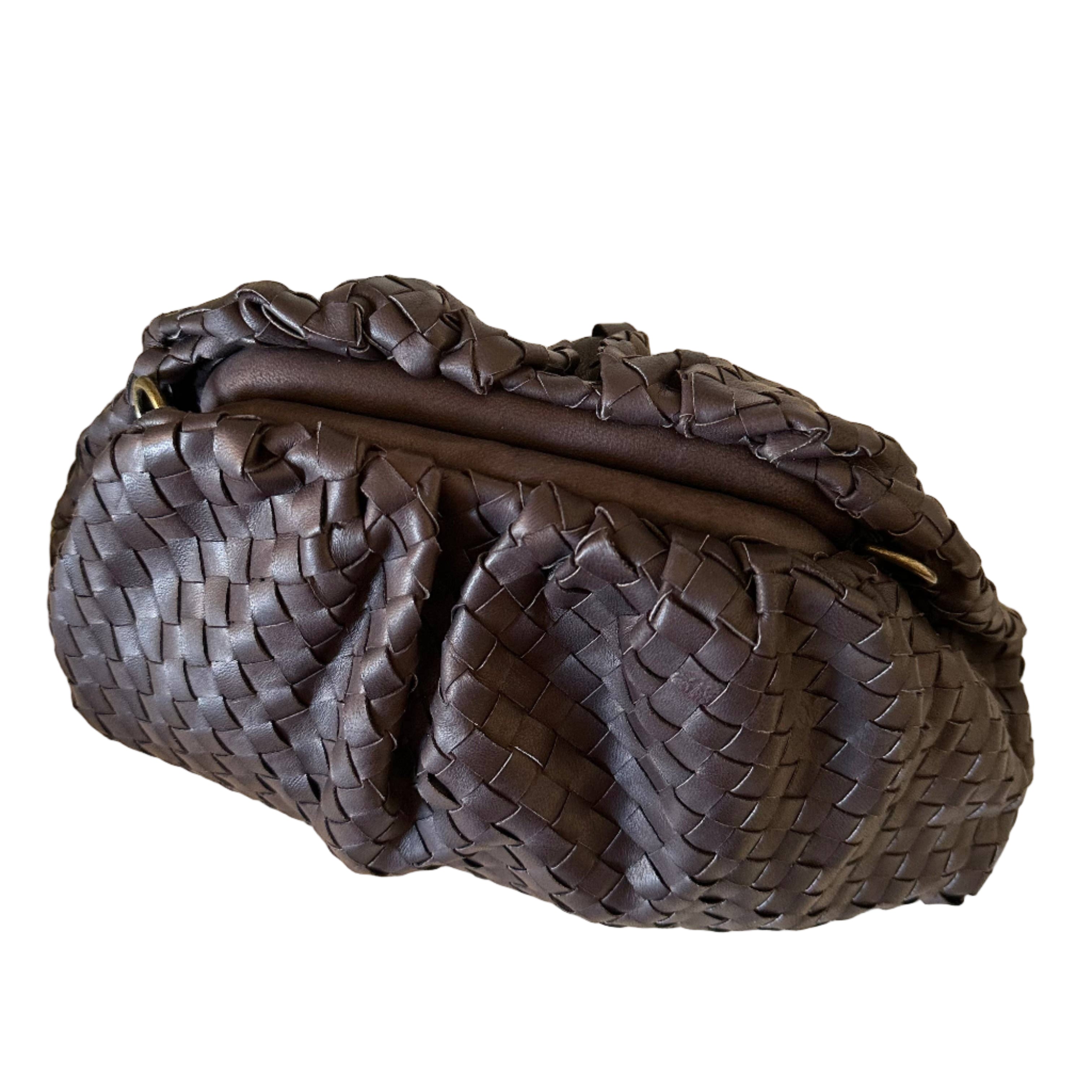 Brown woven handbag on a white background