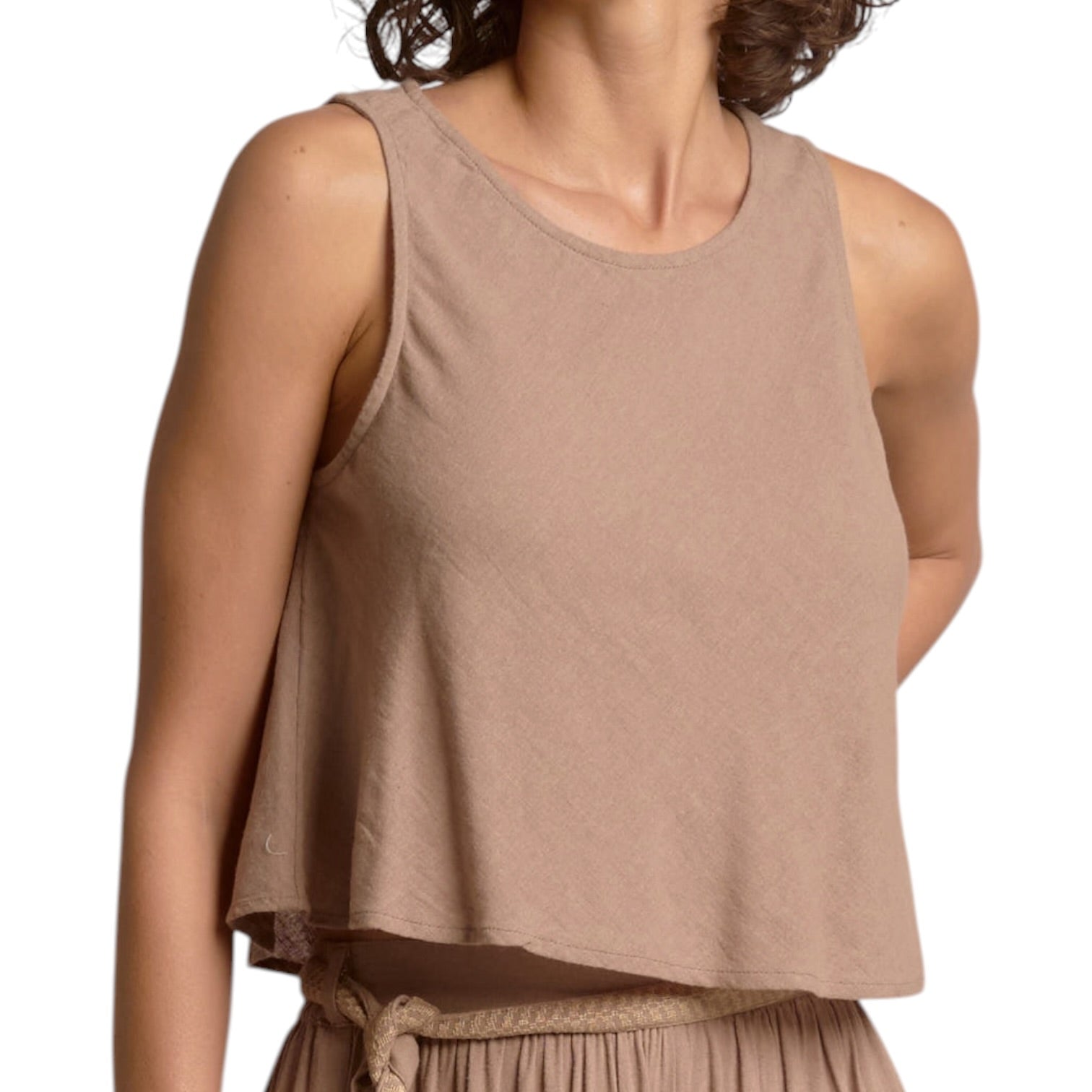 Brown sleeveless top worn by a person on a white background