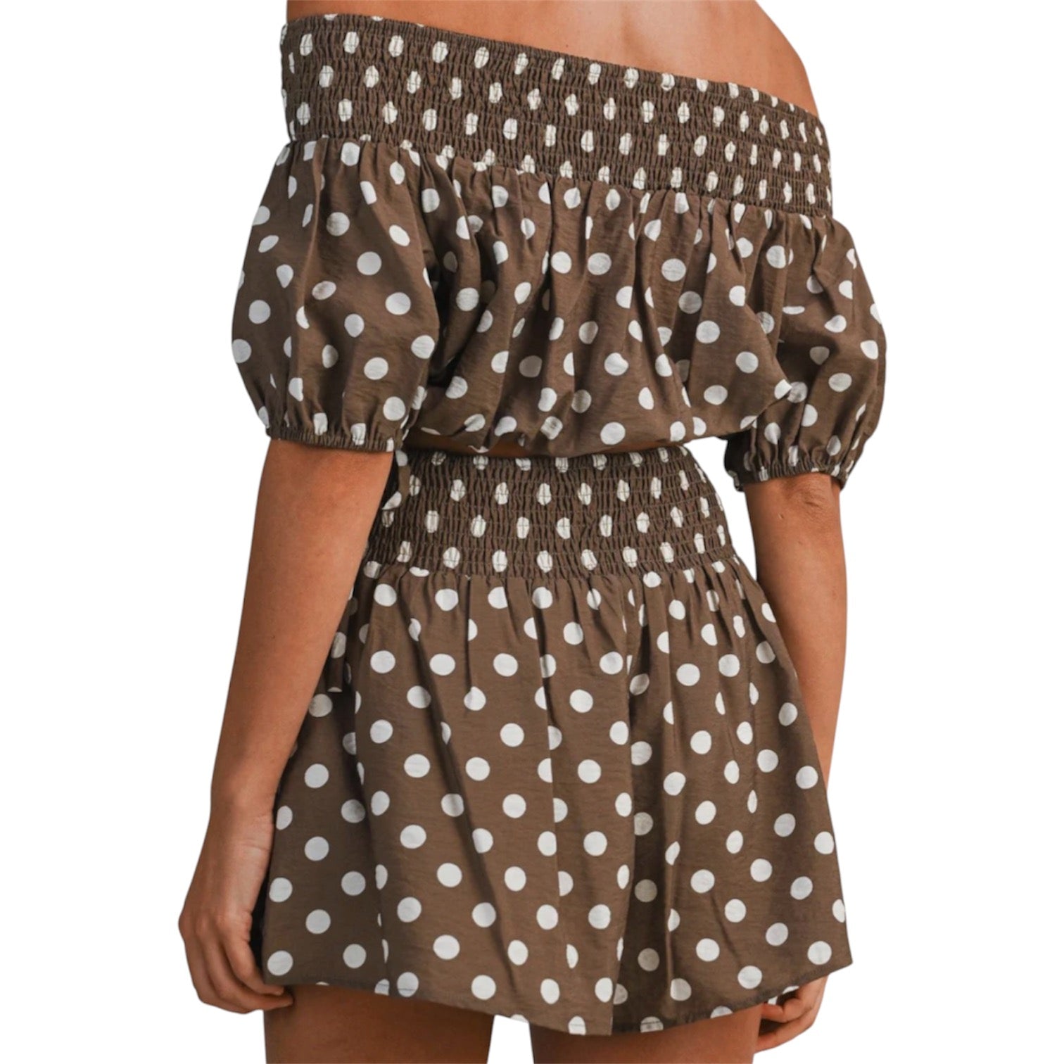 model wearing brown and white polka dot bubble tube top and shorts set