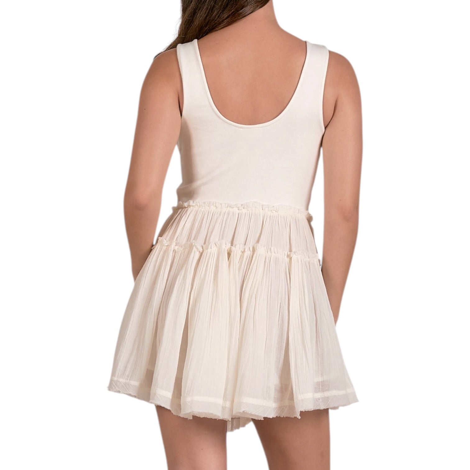 White dress with sheer overlay on a white background