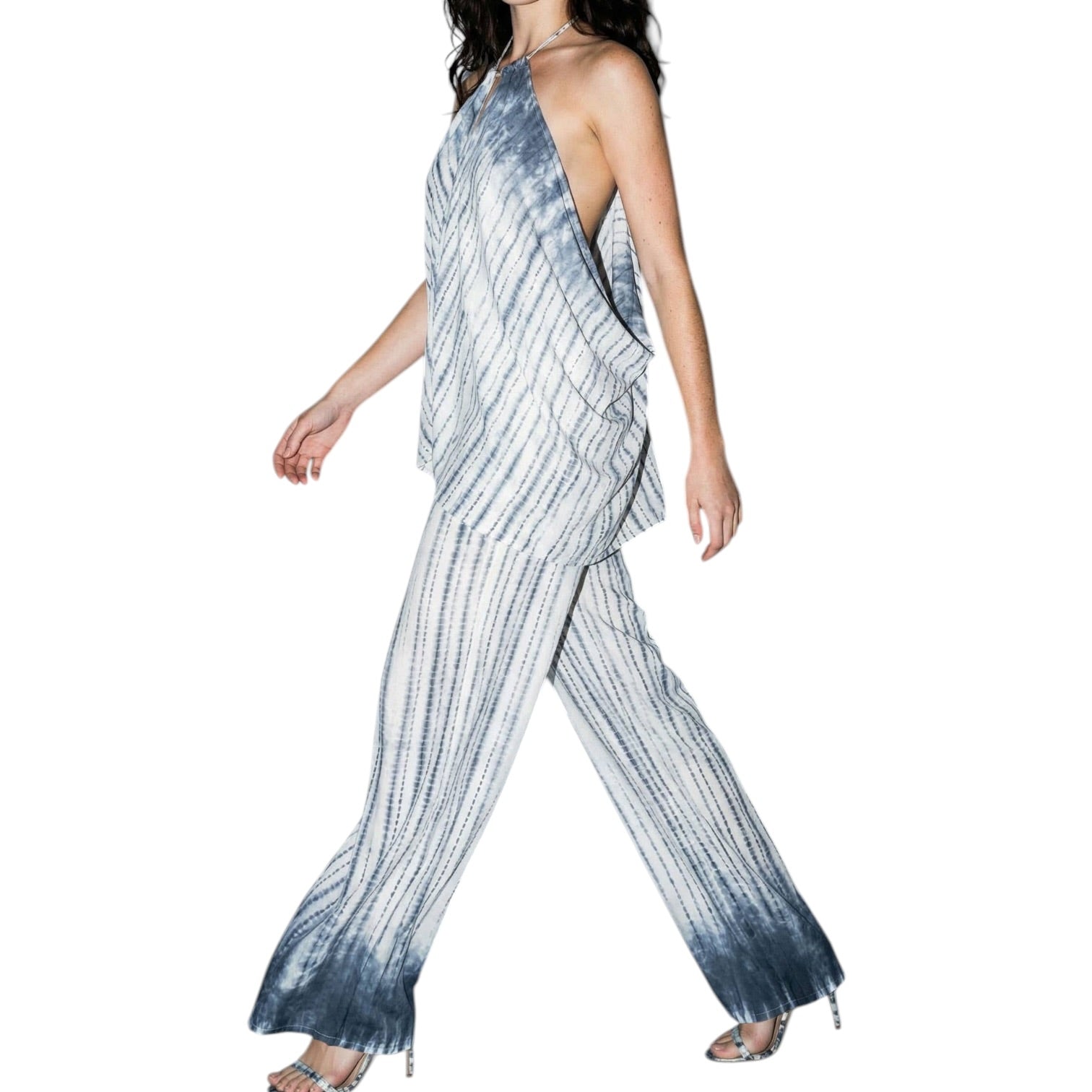 Woman wearing a tie-dye set on a white background