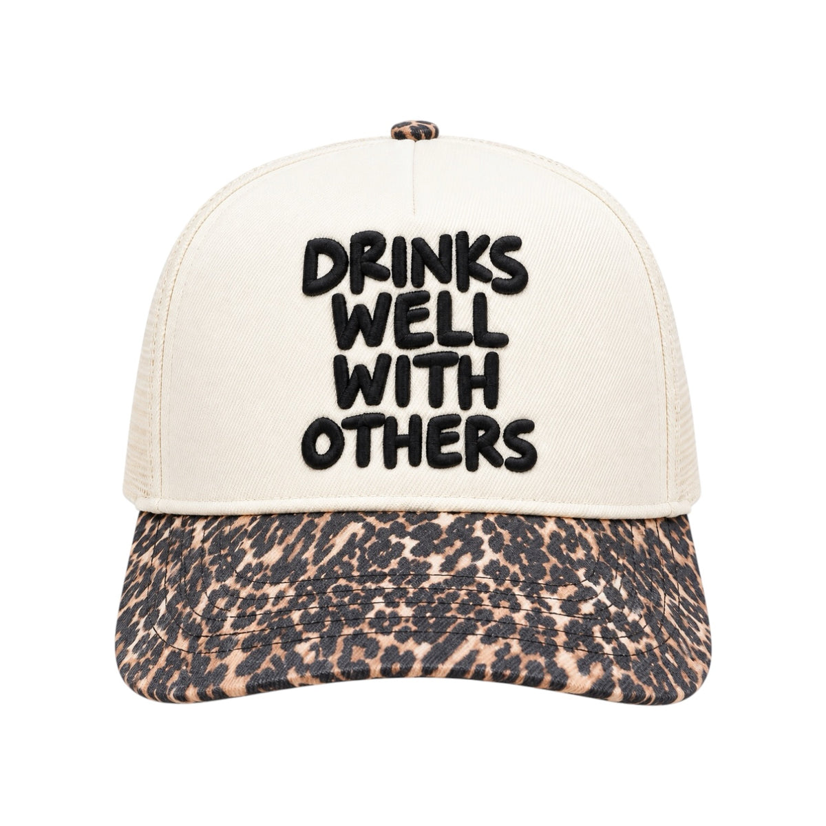 A trucker-style cap with an off-white front panel and black embroidered text reading 'DRINKS WELL WITH OTHERS' on the front, paired with a leopard-print brim in beige, brown, and black.