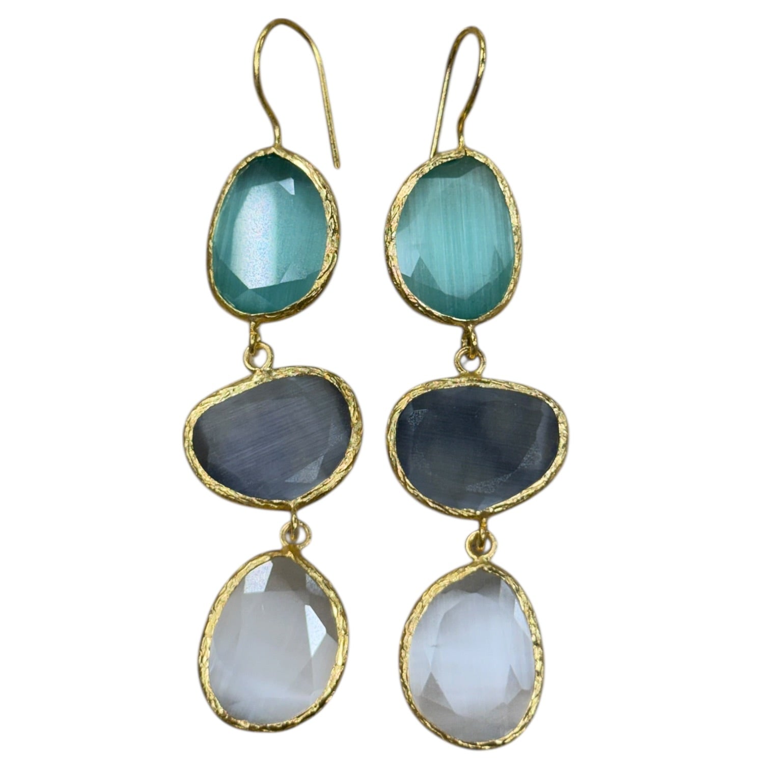 Set of three-tiered earrings with blue, gray, and white stones on a white background