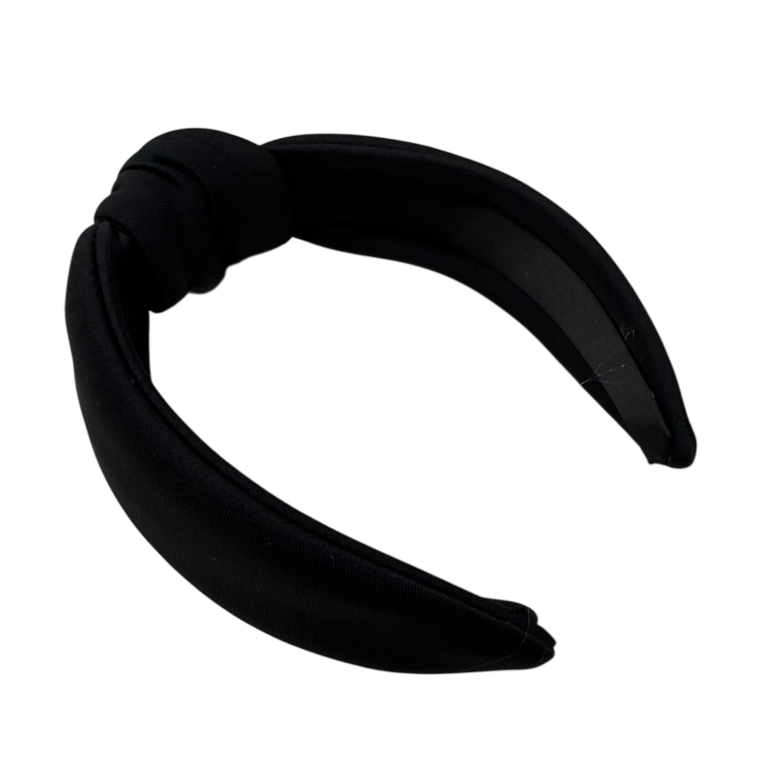 Black headband with a knot on a white background