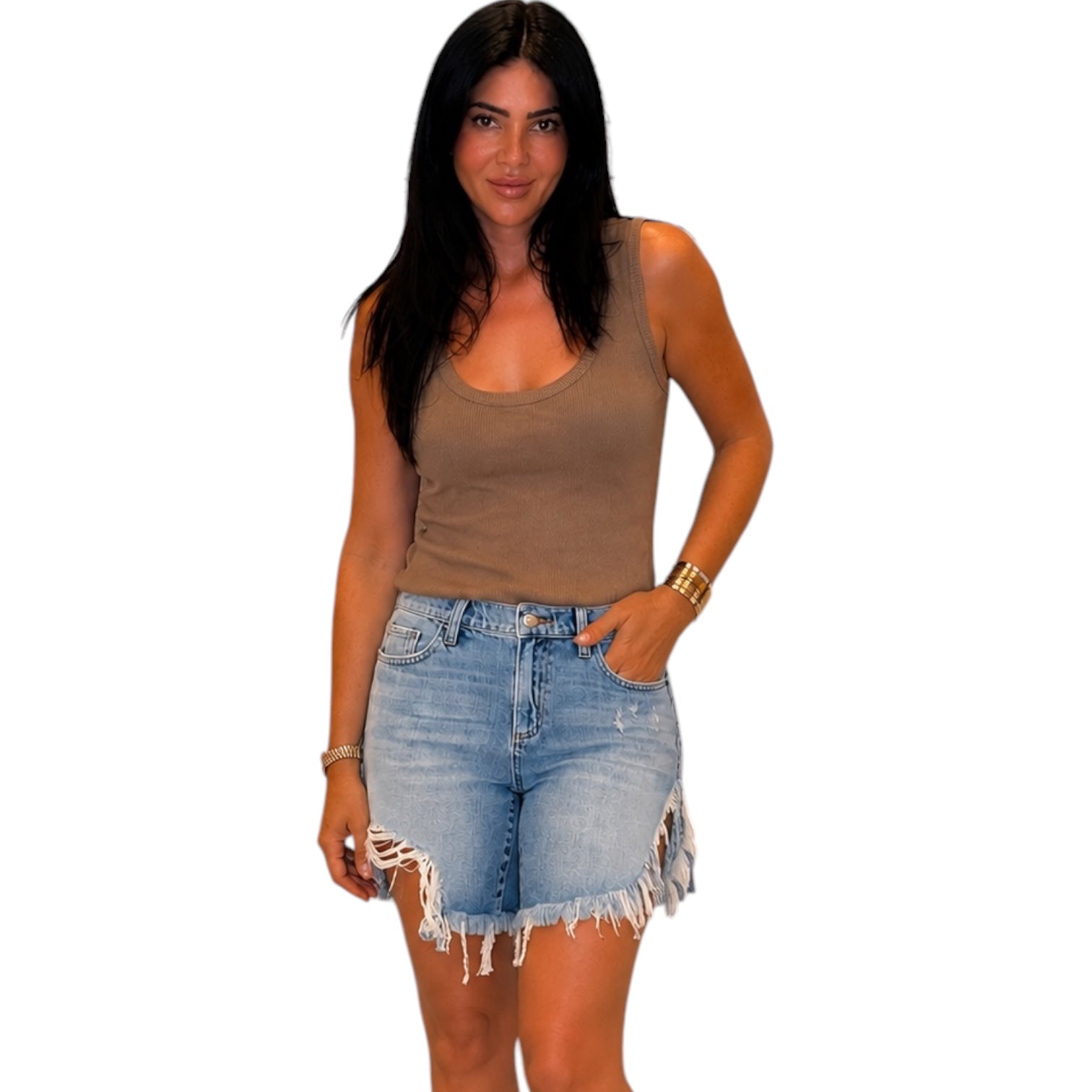 Woman wearing a brown tank top and denim shorts on a white background