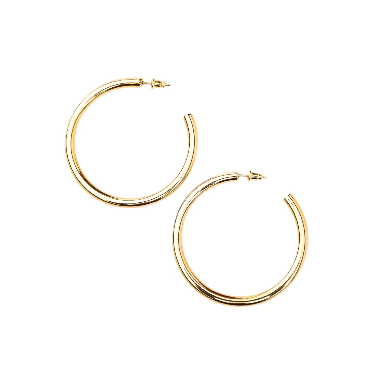 Gold hoop earrings on a white background