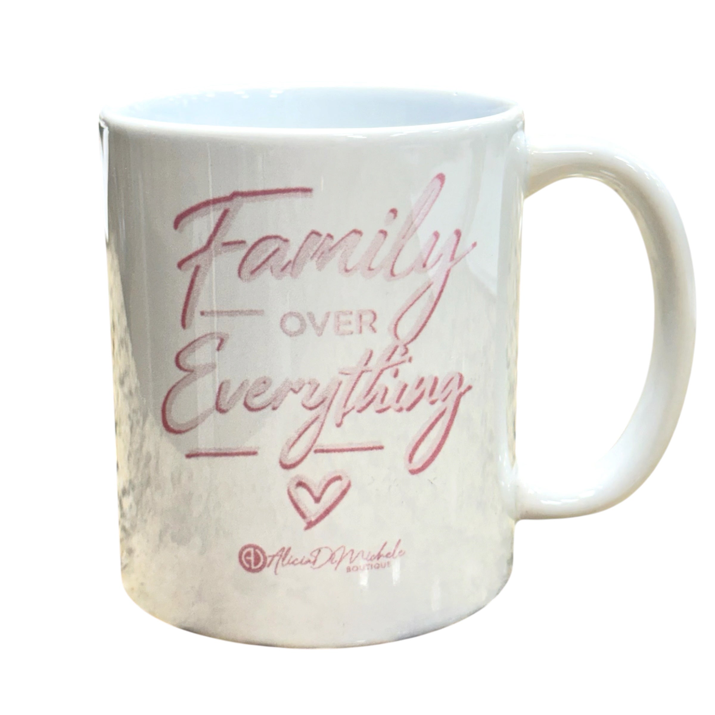 White mug with 'Family Over Everything' text in pink on a white background