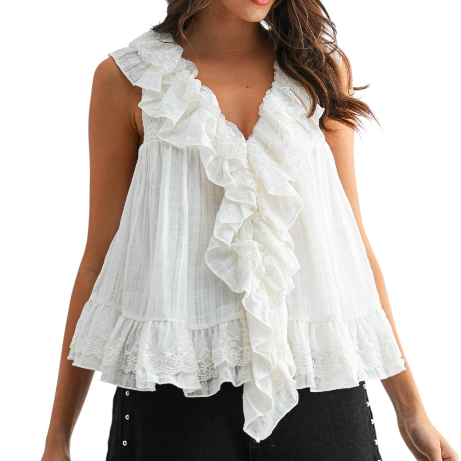ivory ruffled blouse worn by a model on a white background
