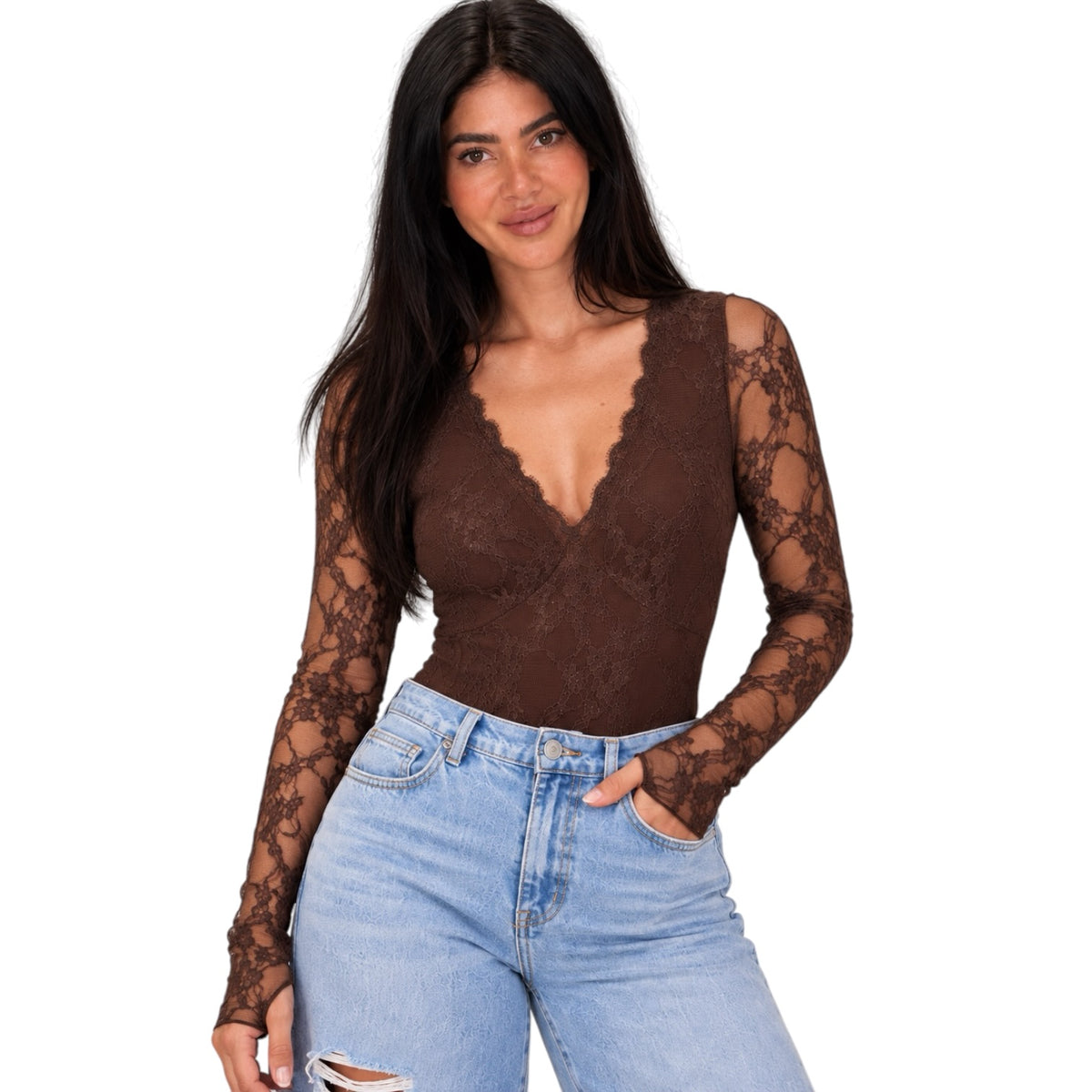 A woman modeling a brown lace long-sleeve bodysuit with a scalloped V-neckline, paired with light-wash blue jeans, against a plain white background.