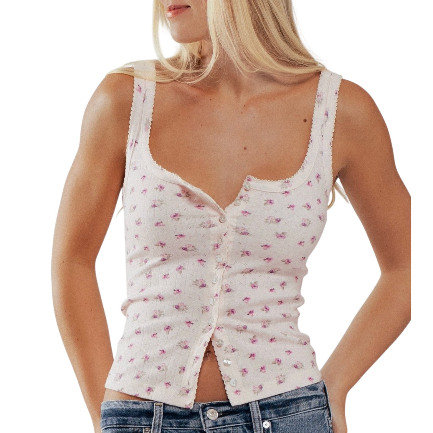 Woman wearing a white floral tank top on a white background