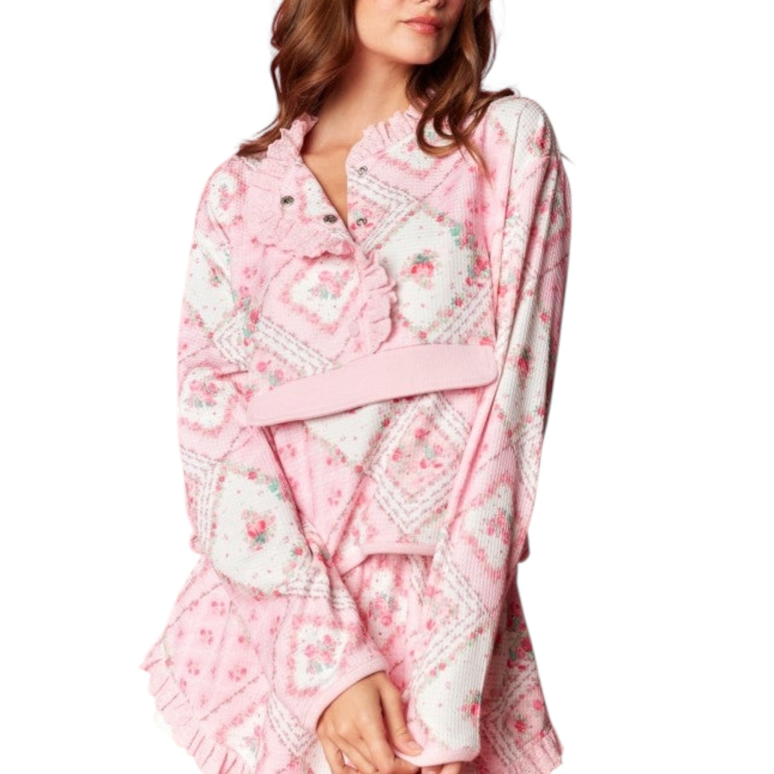 Woman wearing a pink floral top on a white background