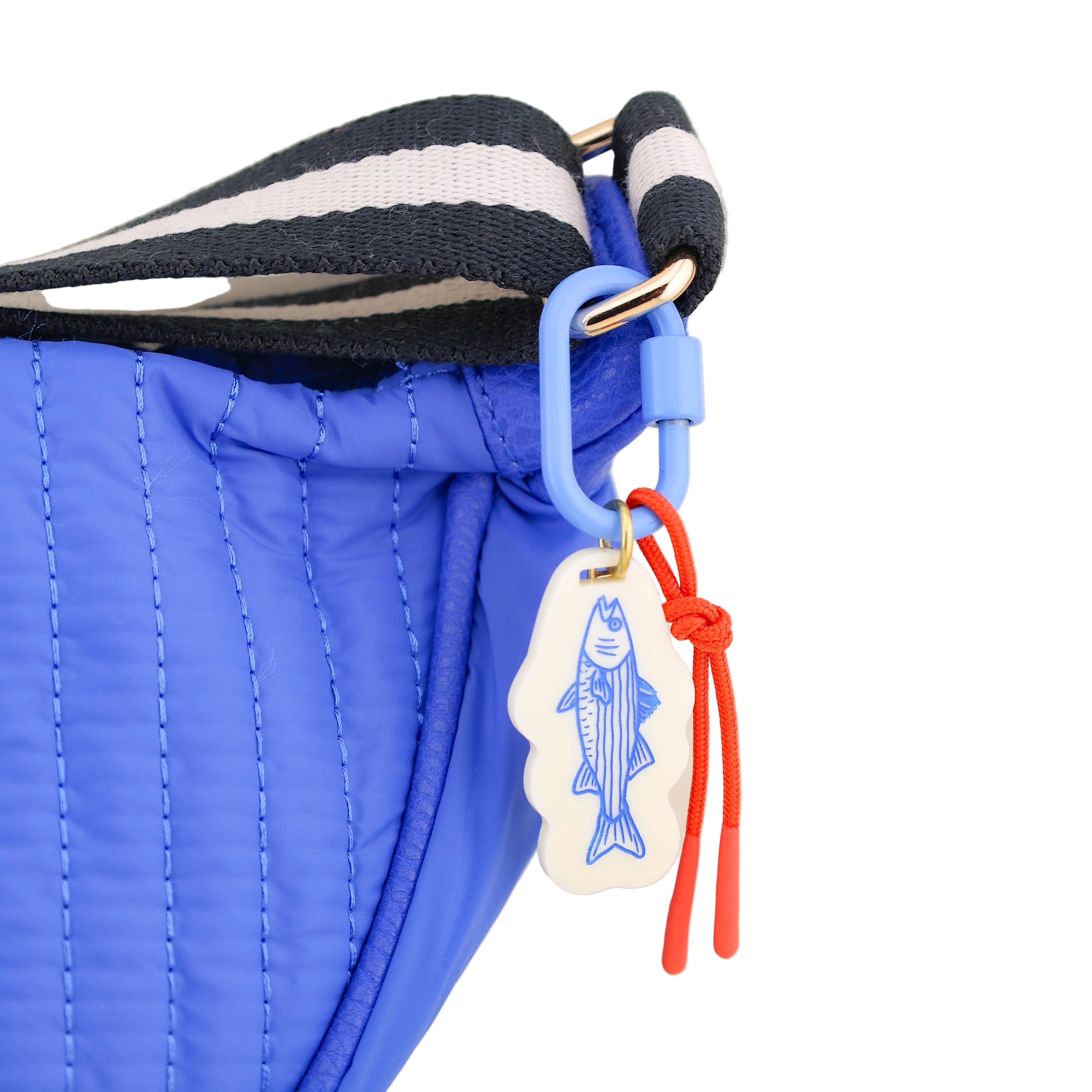 Blue bag with a fish-themed tag and red string on a white background