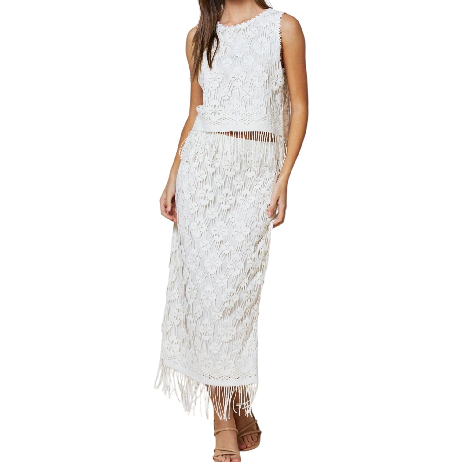 White lace set with fringe details on a white background