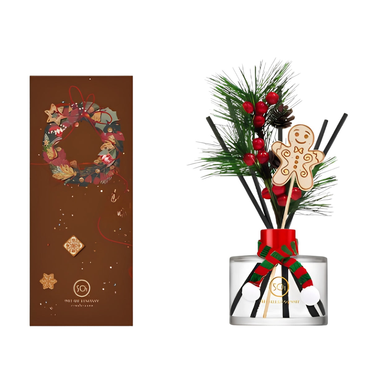 Holiday-themed reed diffuser set with a clear glass bottle, black reeds, green pine branches, red berries, a gingerbread man ornament, and a red-and-green ribbon, shown beside its brown decorative box featuring a wreath design.