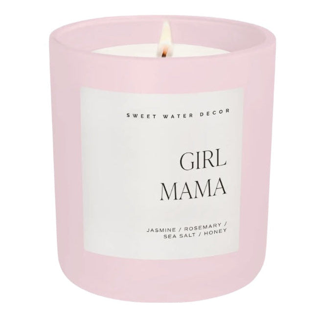 Pink candle with a label reading 'Girl Mama' on a white background