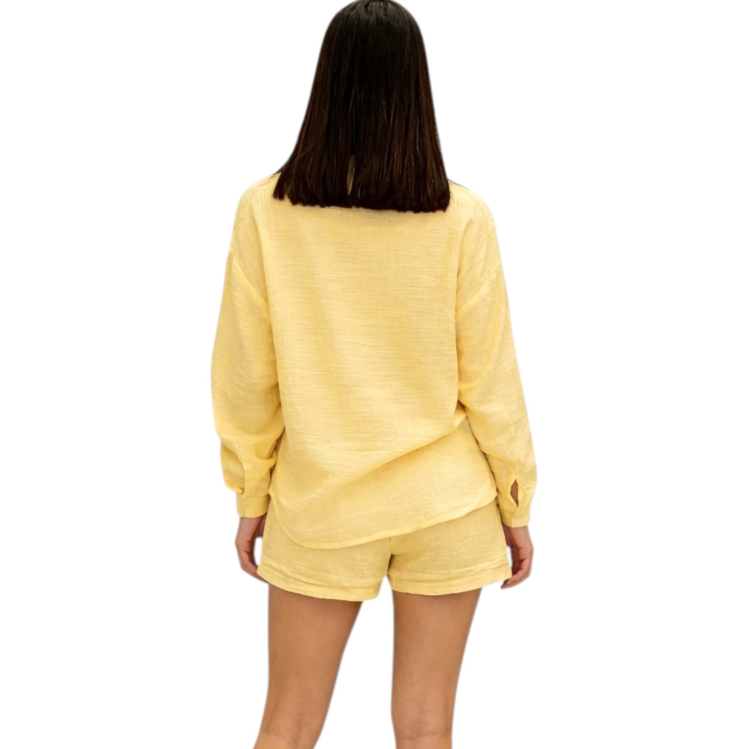 Person wearing a yellow outfit on a white background