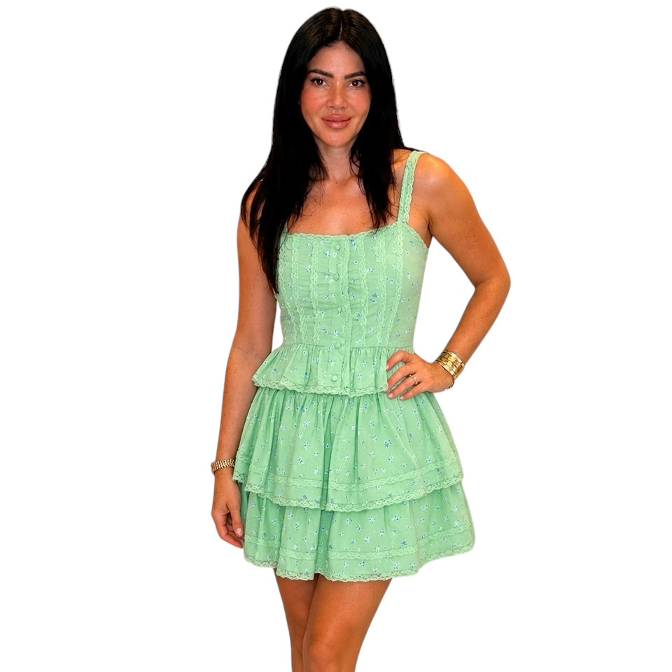 Woman wearing a light green set on a white background