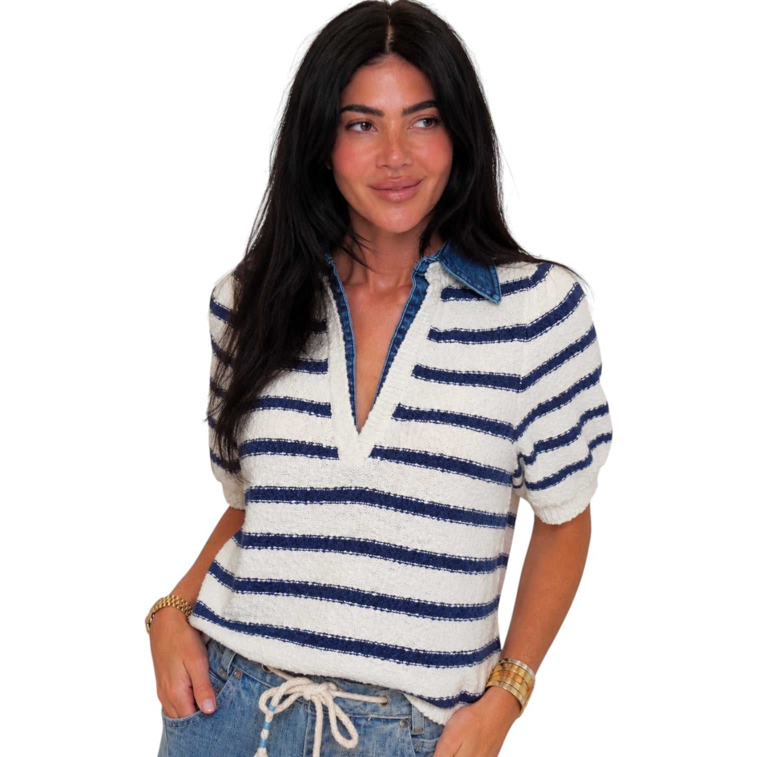 Woman wearing a blue and white striped sweater on a white background