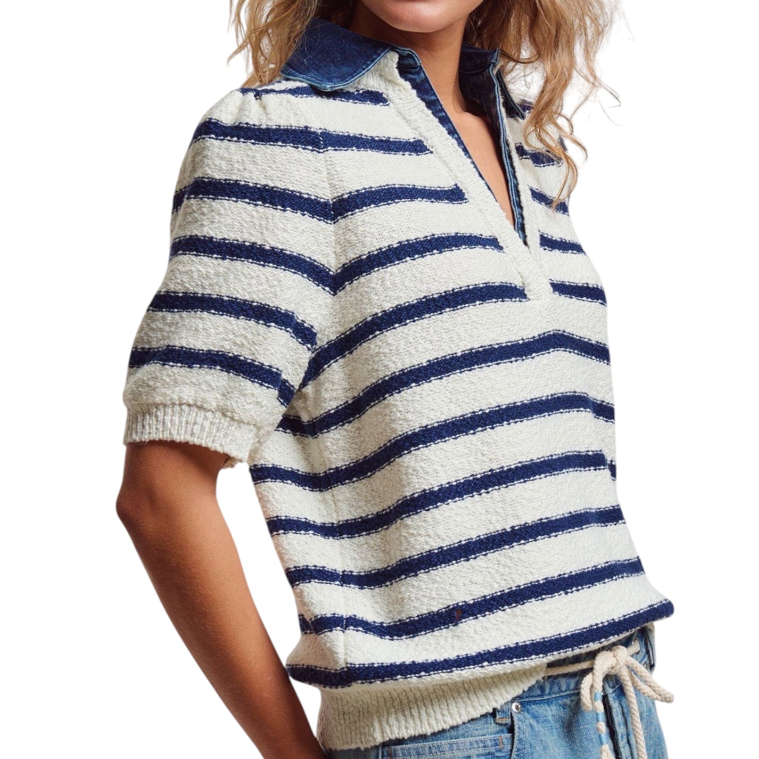 Person wearing a blue and white striped sweater with a white background