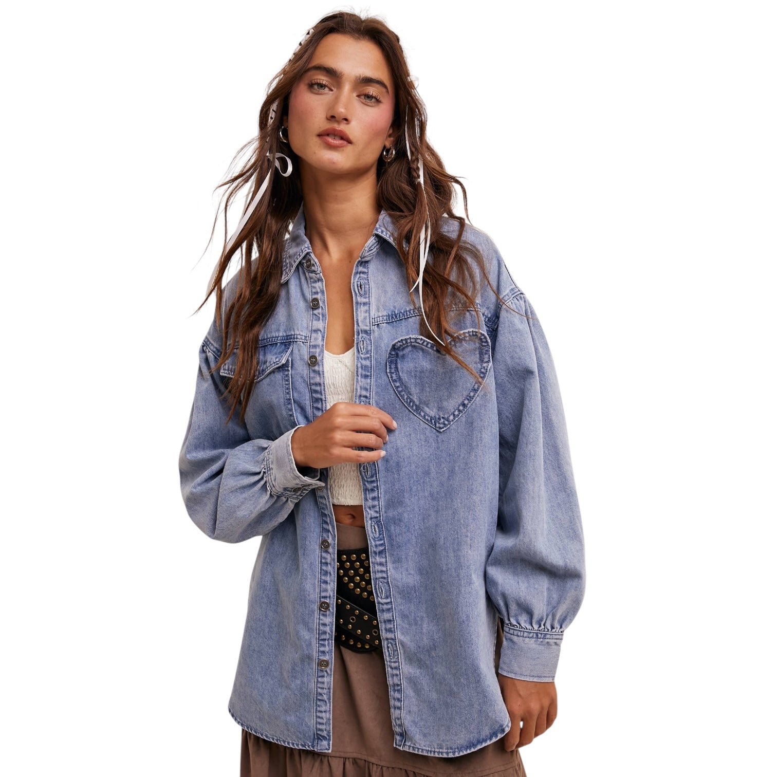 Woman wearing a denim top on a white background
