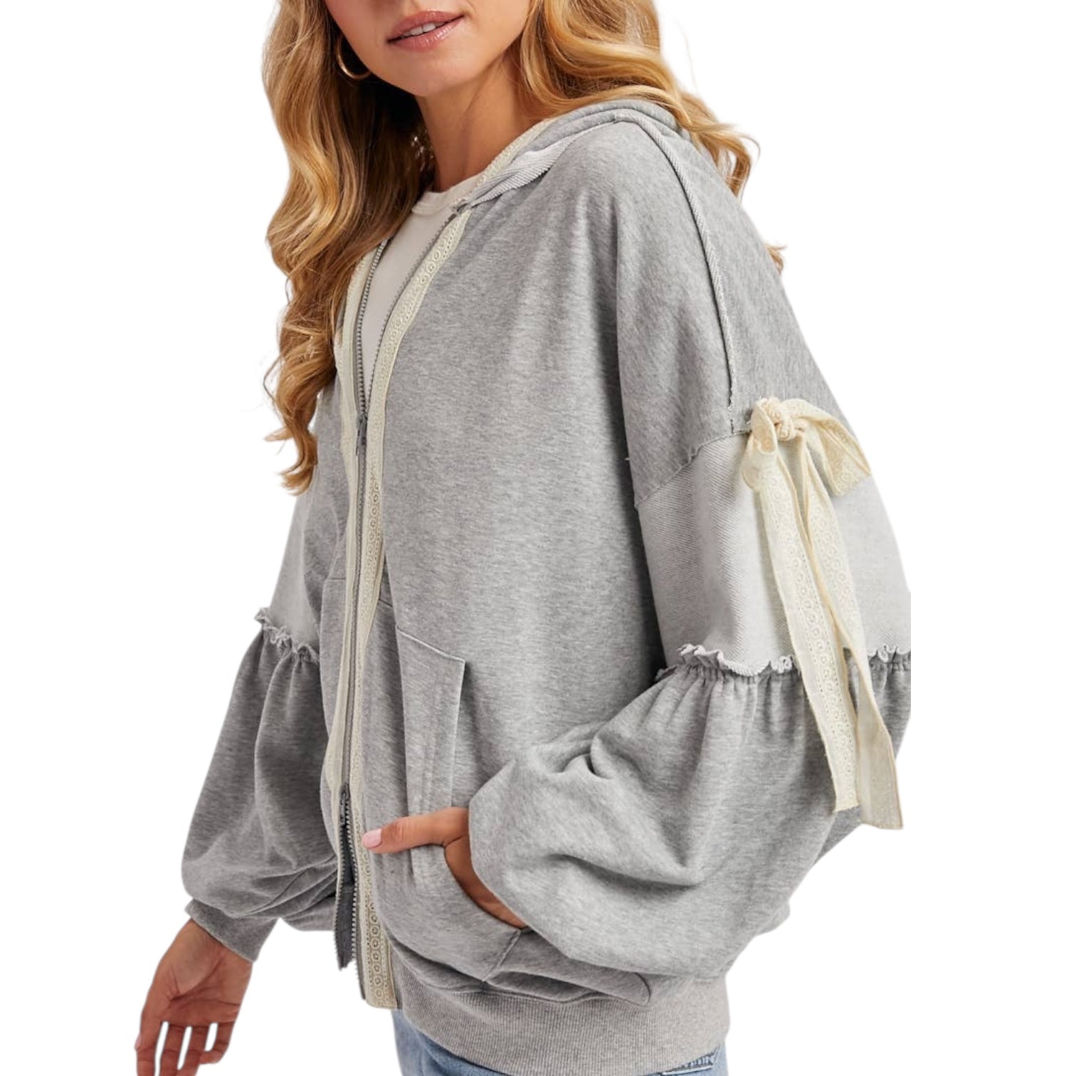 Gray hoodie with lace details on sleeves worn by a model on a white background
