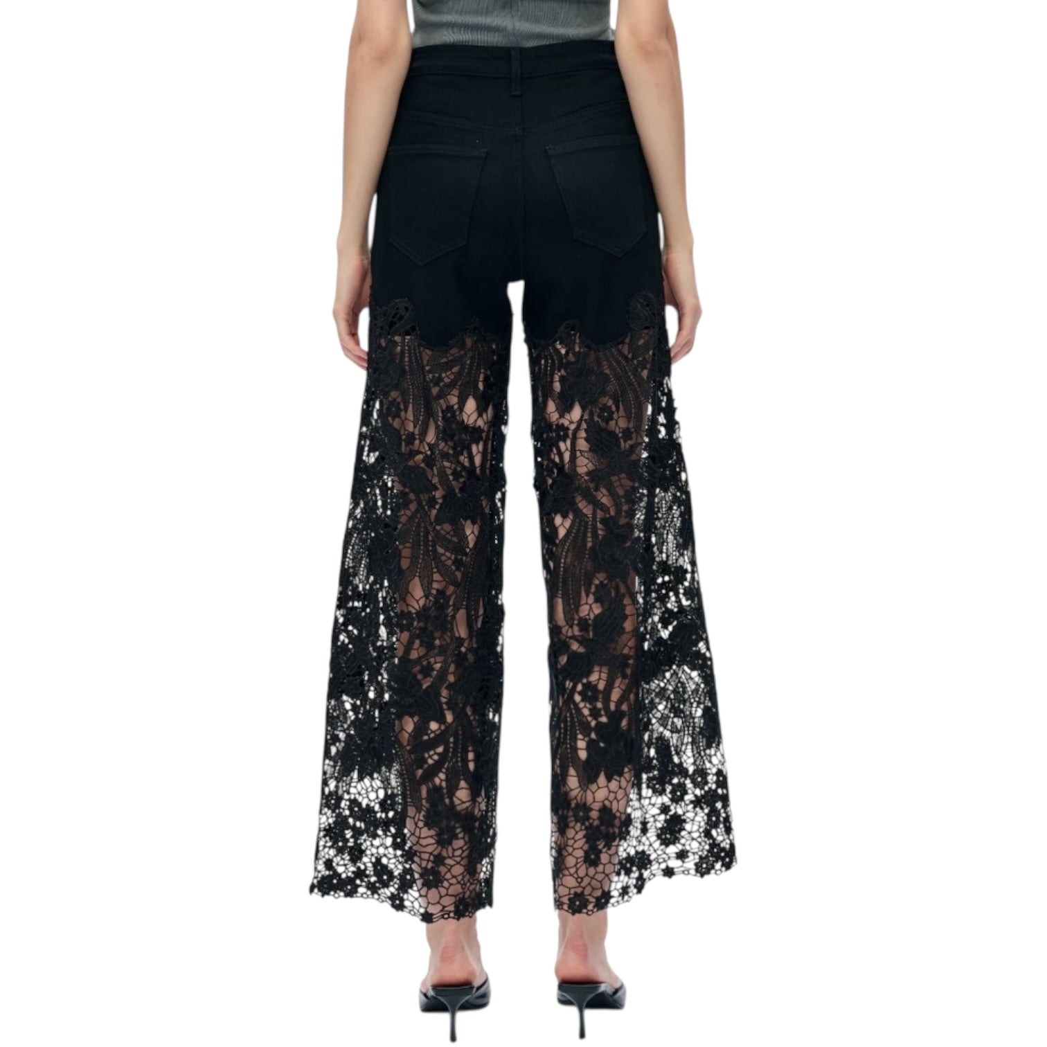 Black lace pants worn by a person on a white background