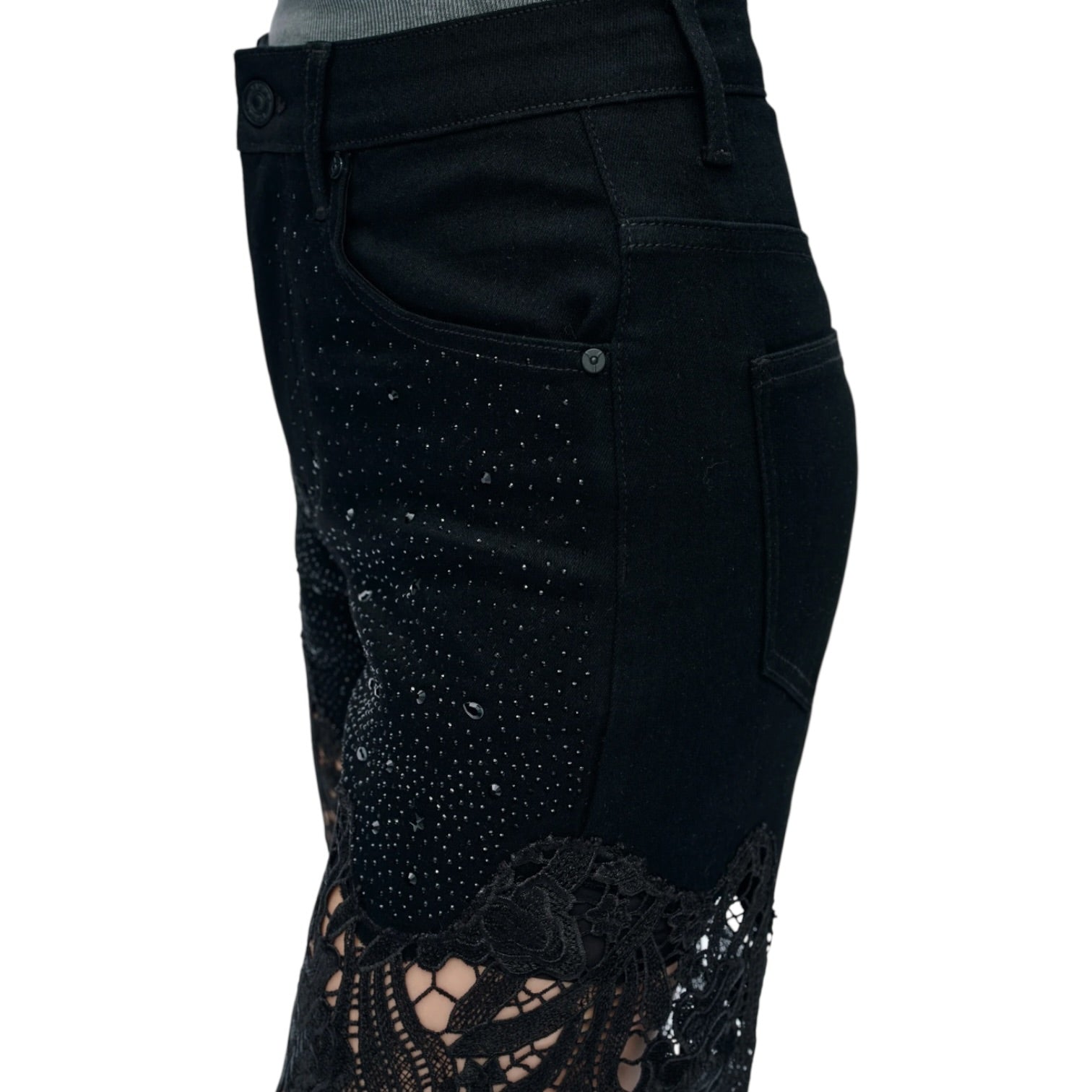 Black pants with sequin and lace details on a white background