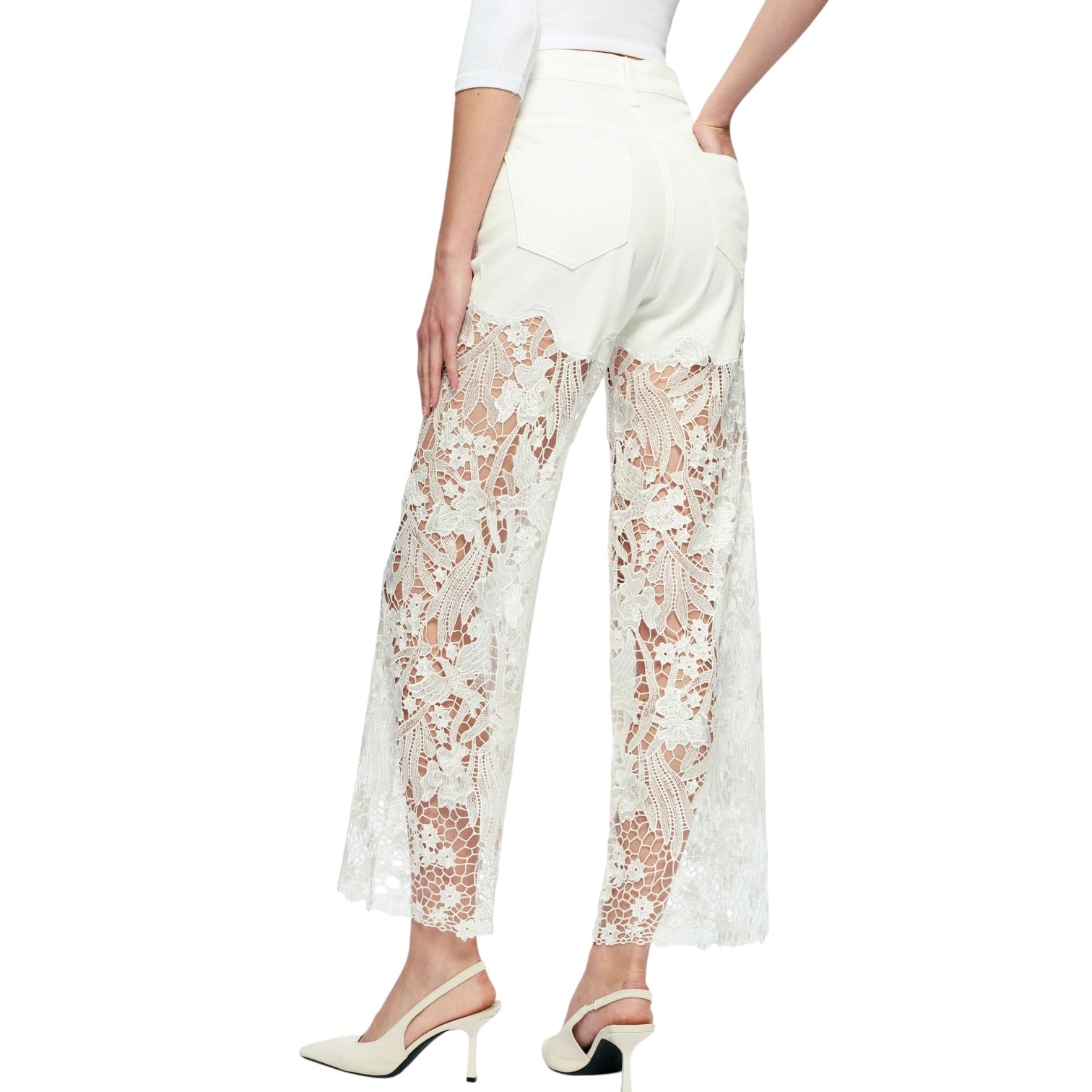 White lace pants worn by a person on a white background