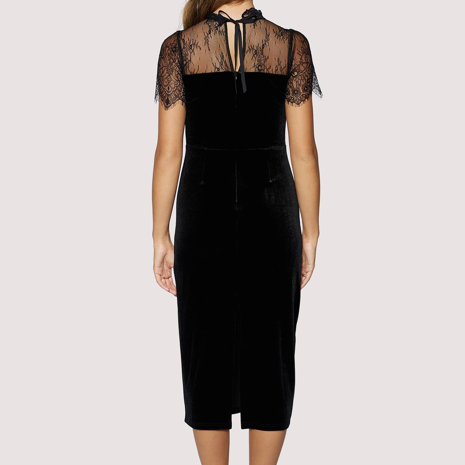 Black dress with lace details on a white background