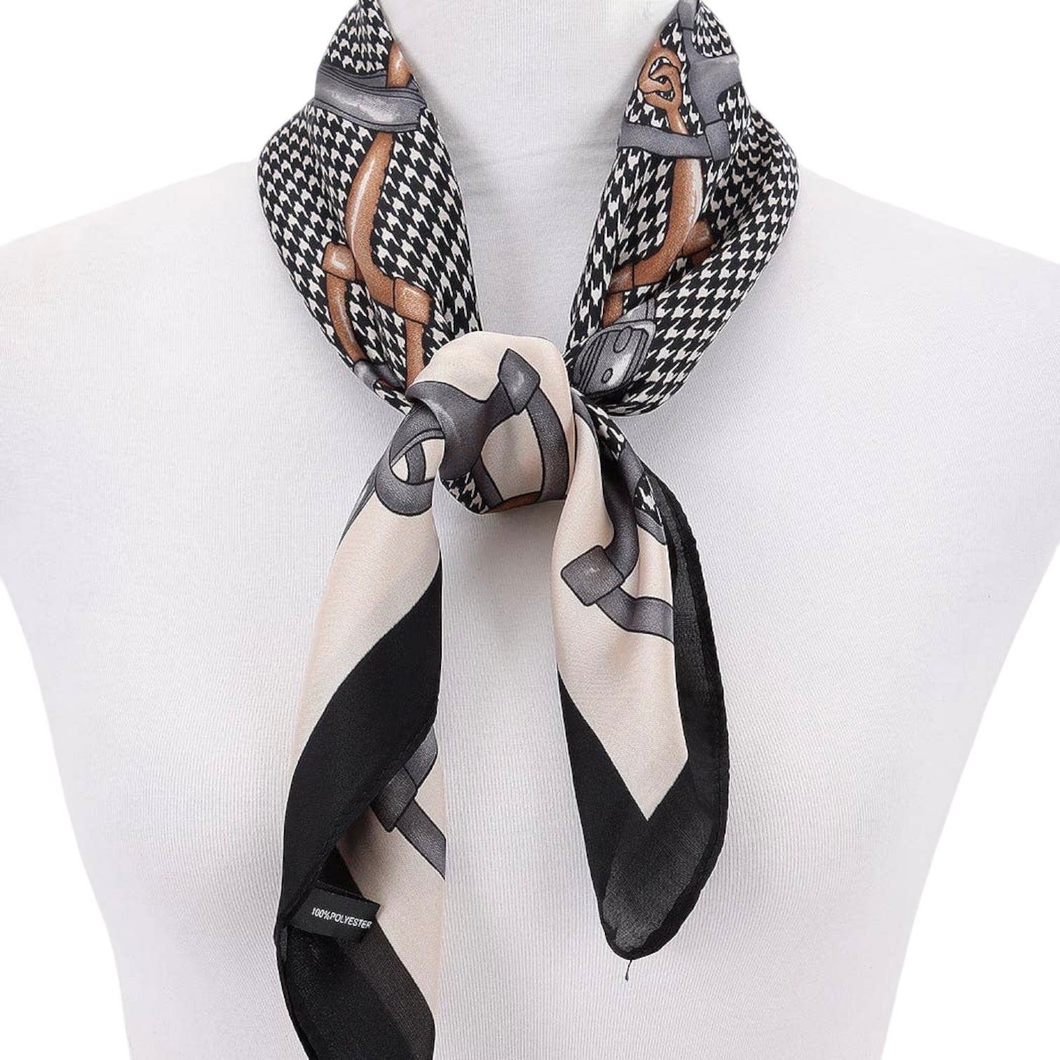 Scarf with black and white pattern on a mannequin against a white background