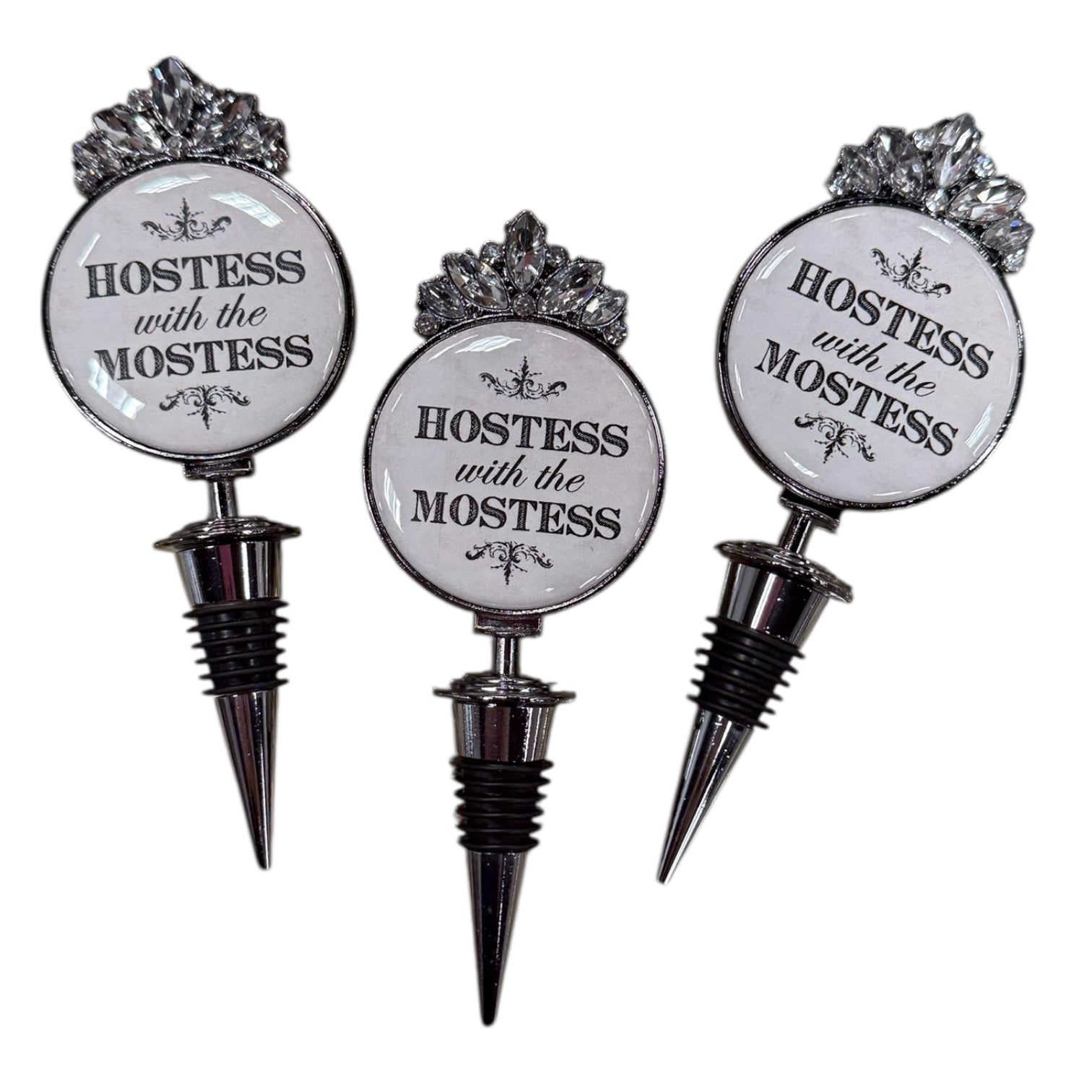 Three bottle stoppers with 'Hostess with the Mostest' text on a white background