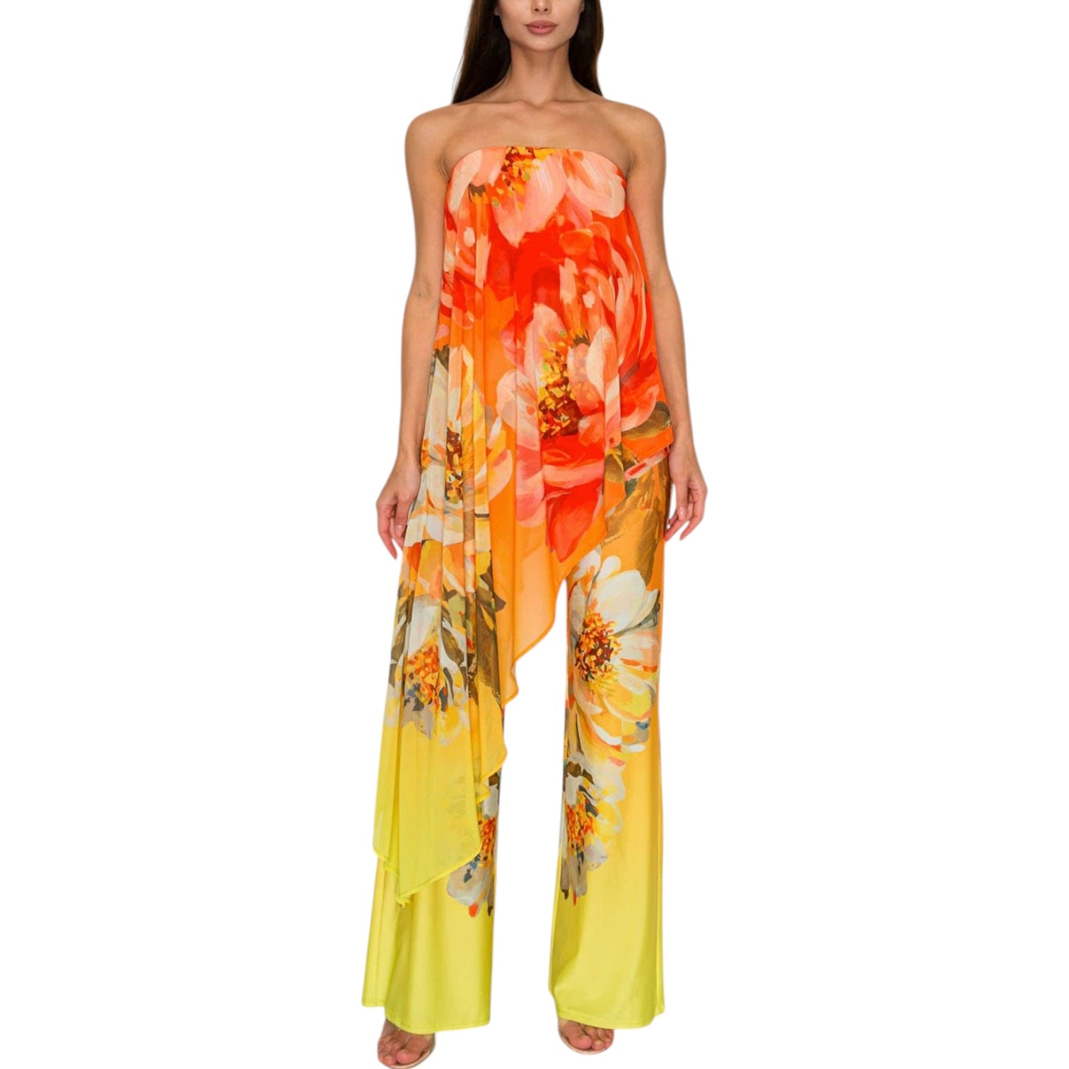 Woman wearing a strapless floral jumpsuit with orange and yellow flowers on a white background