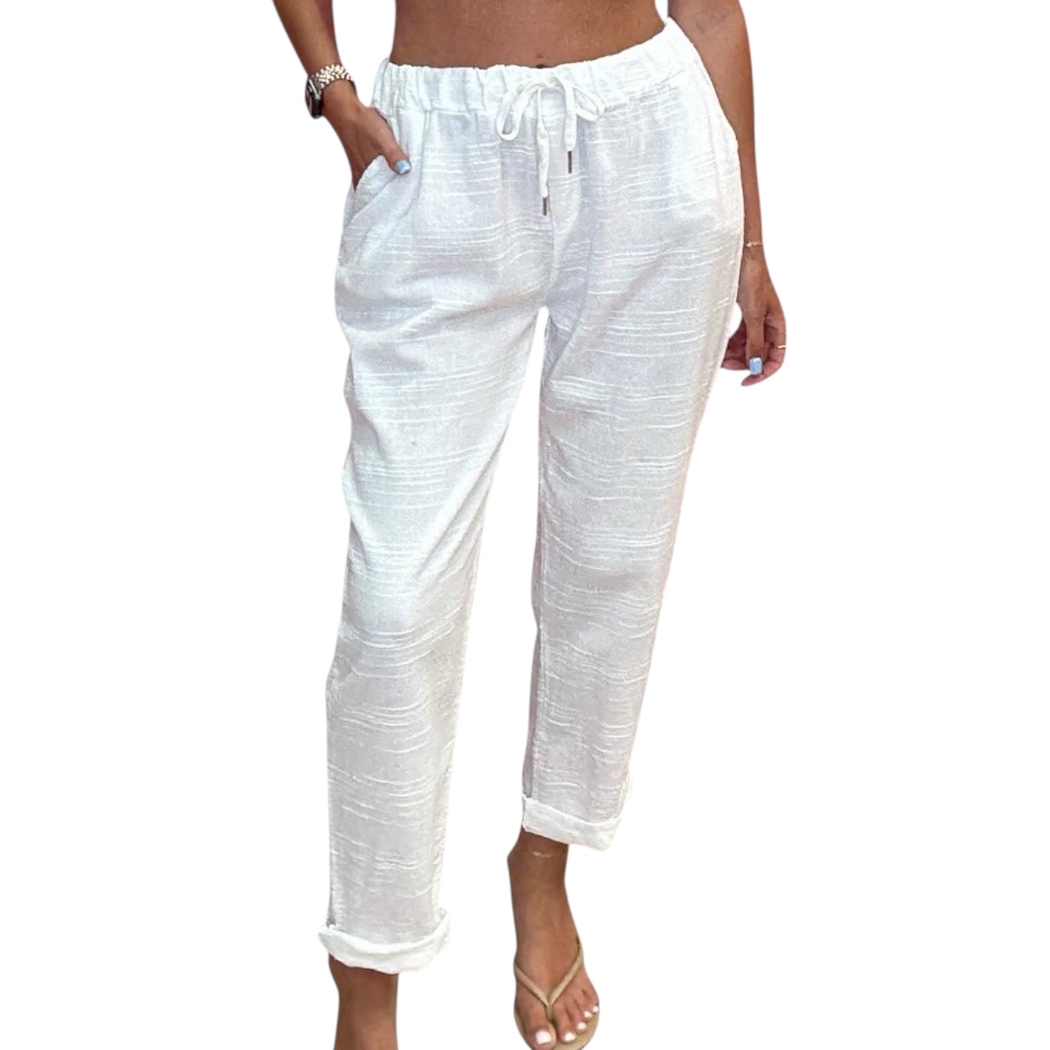 White striped pants worn by a person on a white background