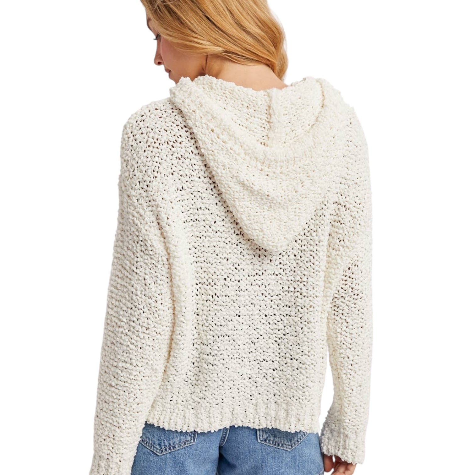 White textured hoodie worn by a person on a white background