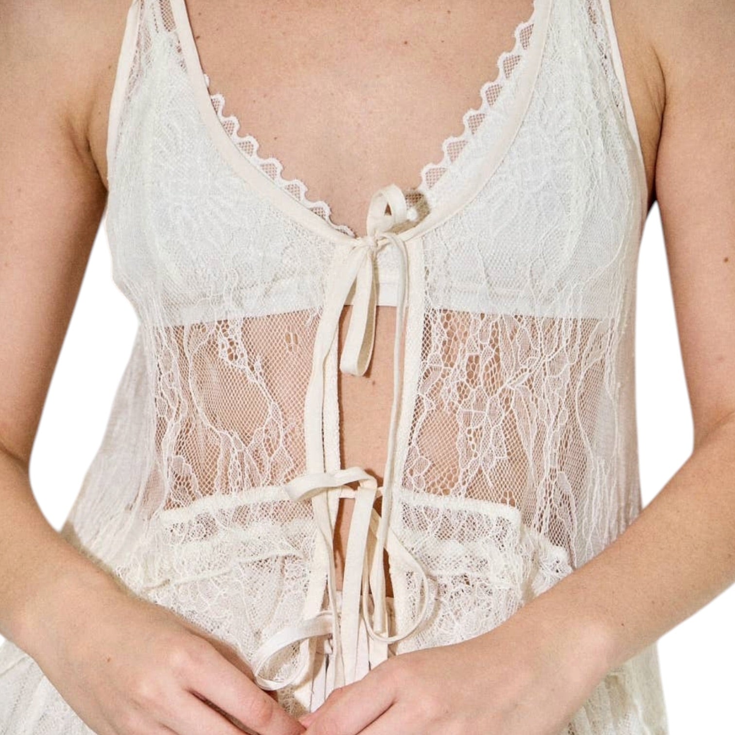 Cream lace dress with tiered layers on a white background