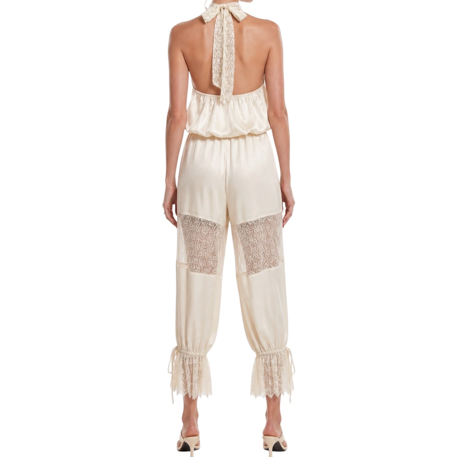 Beige jumpsuit with lace details on a white background