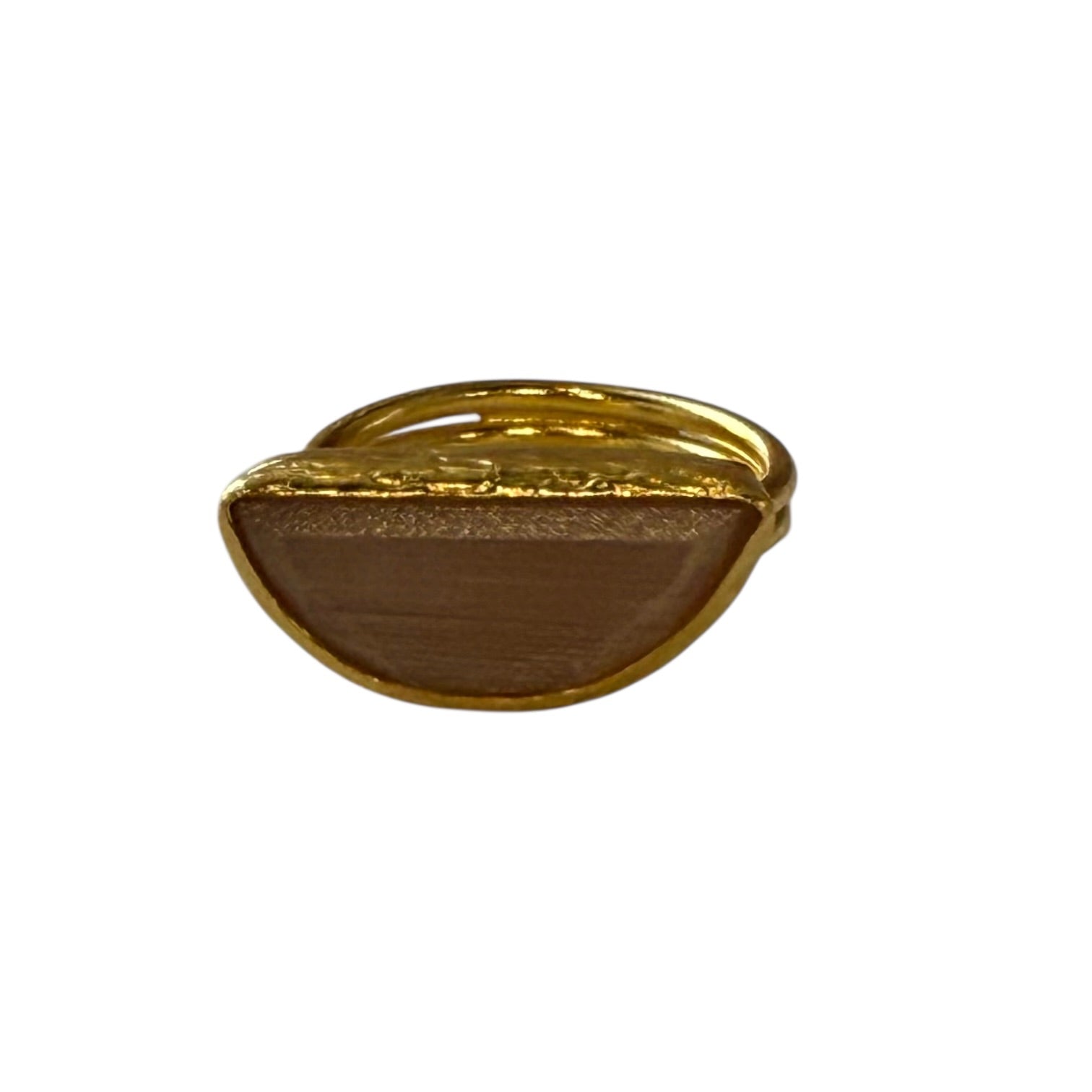 Gold-colored ring on a white background