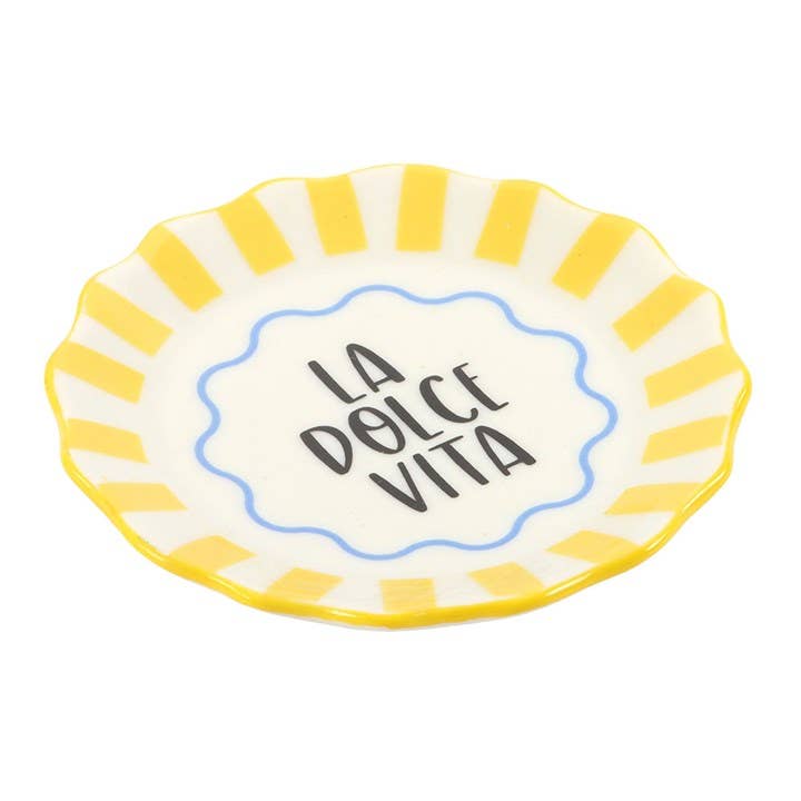 Ceramic plate with yellow rim and 'La Dolce Vita' text on a white background