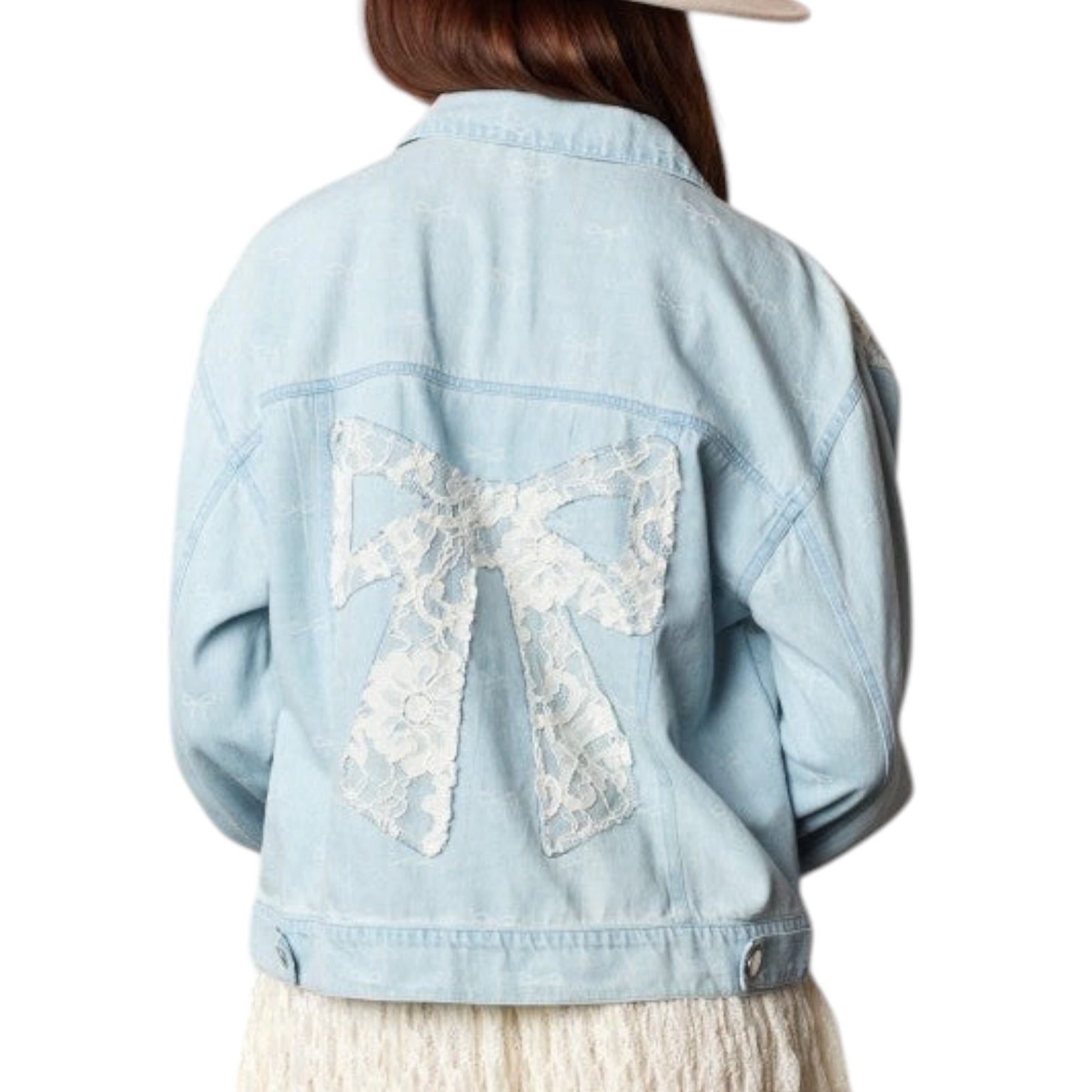 Light blue denim jacket with a large lace bow on the back, worn by a person.