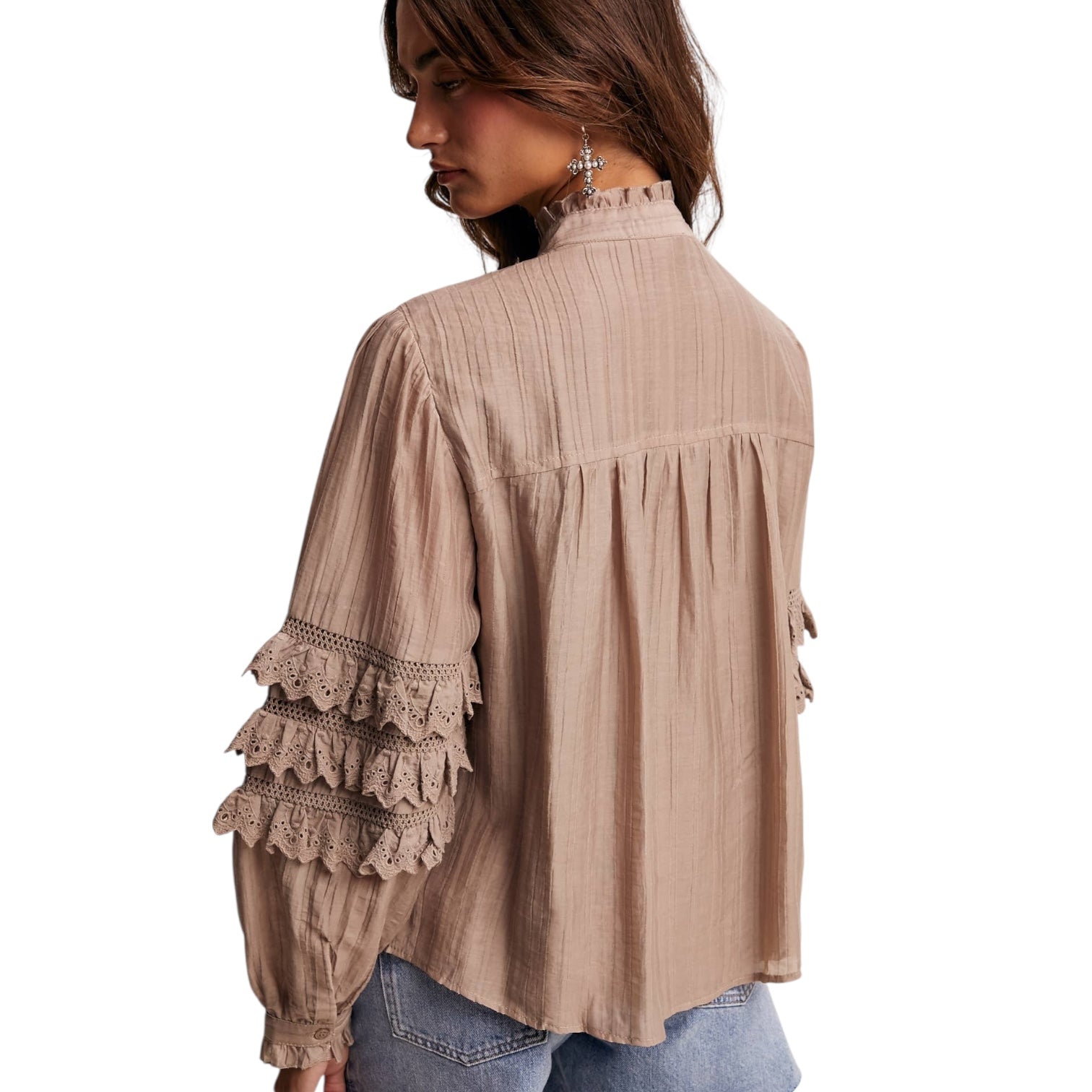 Beige blouse with lace details on a white background