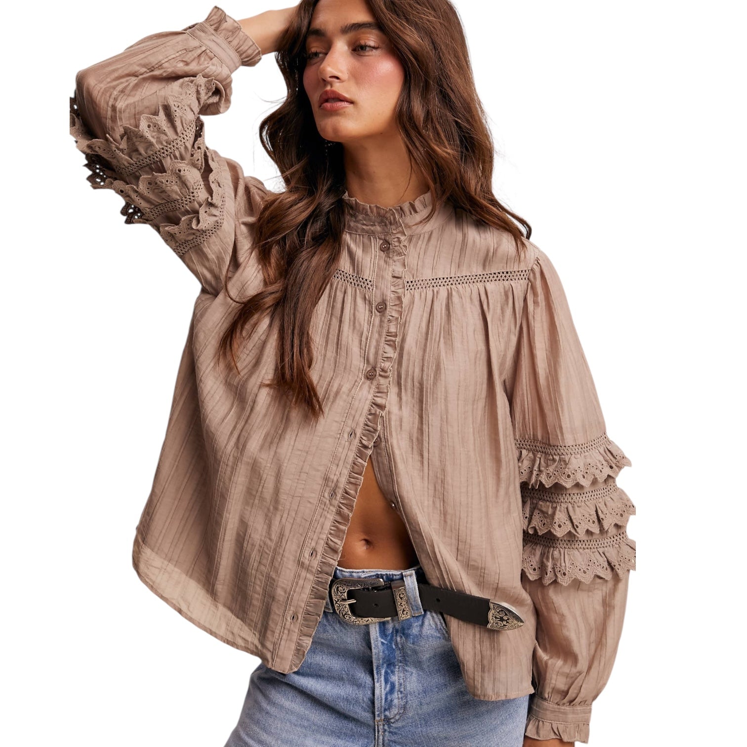 Woman wearing a beige lace-up blouse with a white background