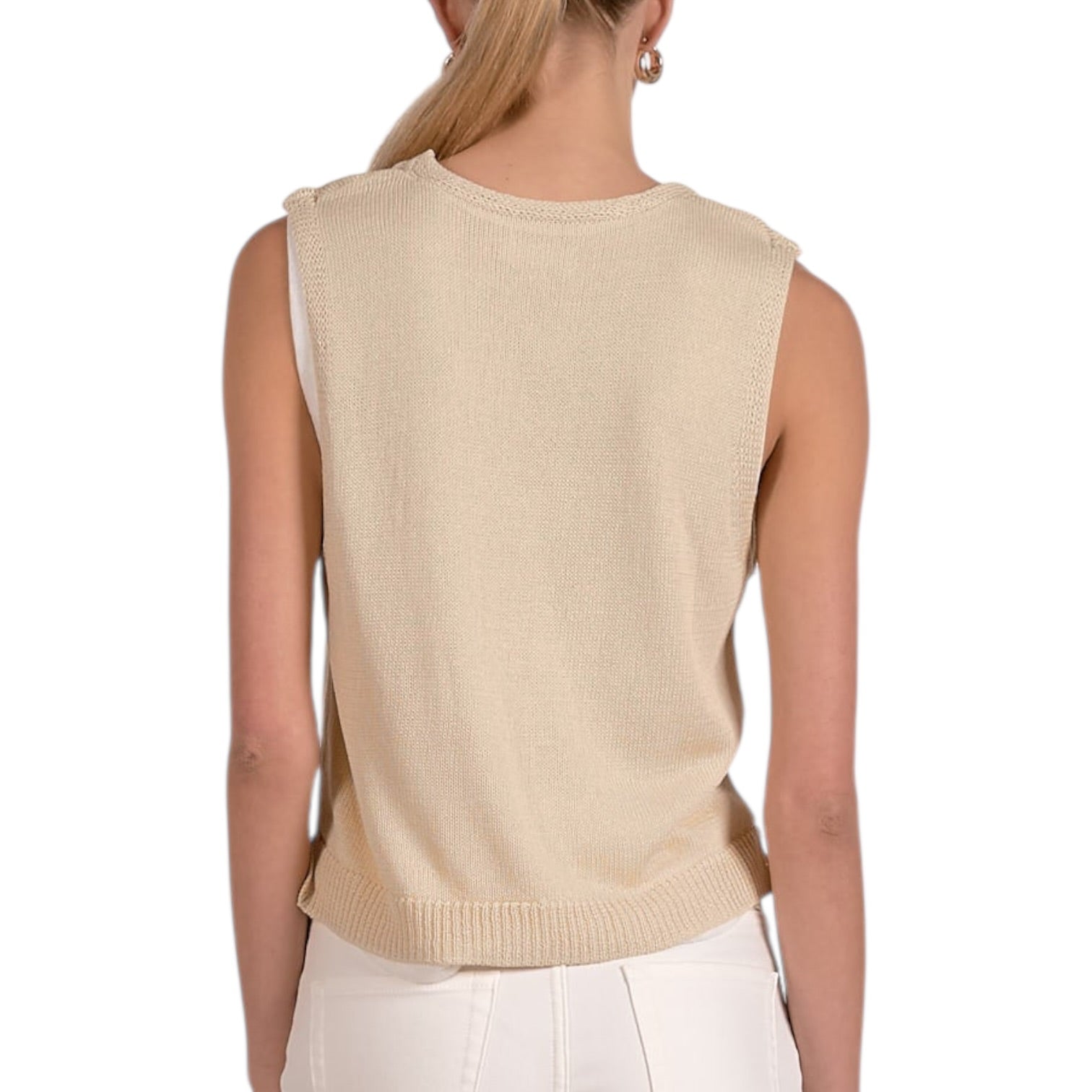 Beige sleeveless knit top worn by a person on a white background