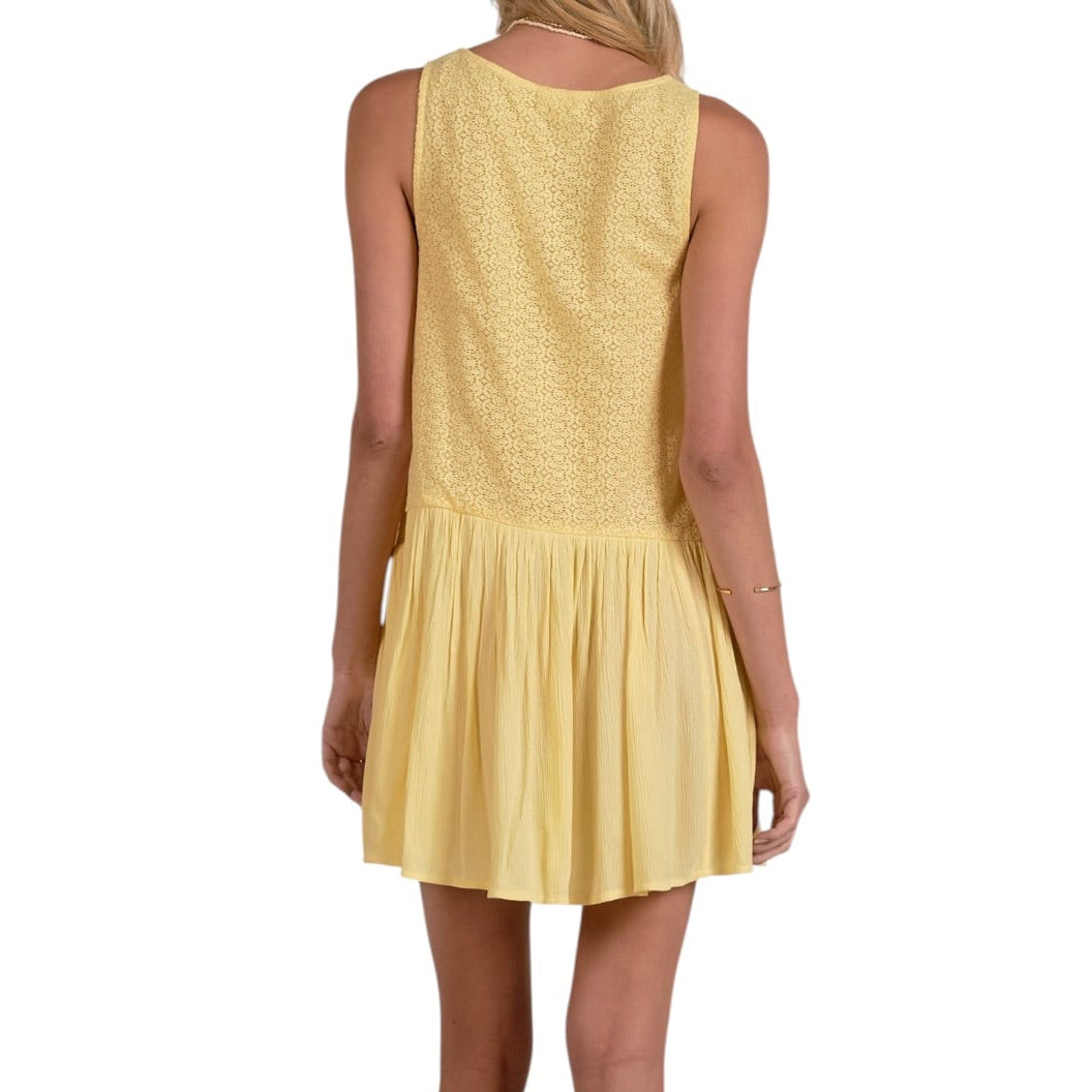 Yellow dress worn by a person on a white background