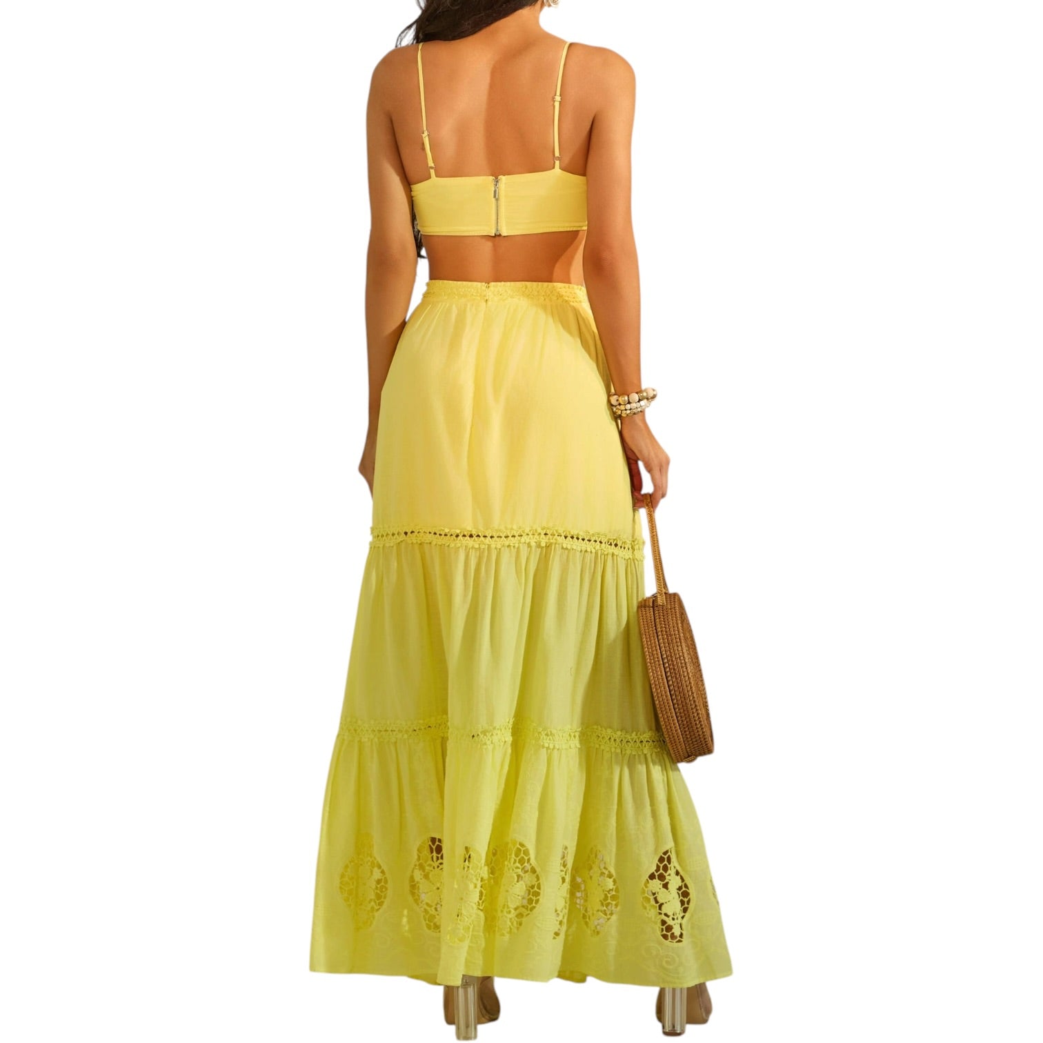 Woman wearing a yellow skirt set with a white background
