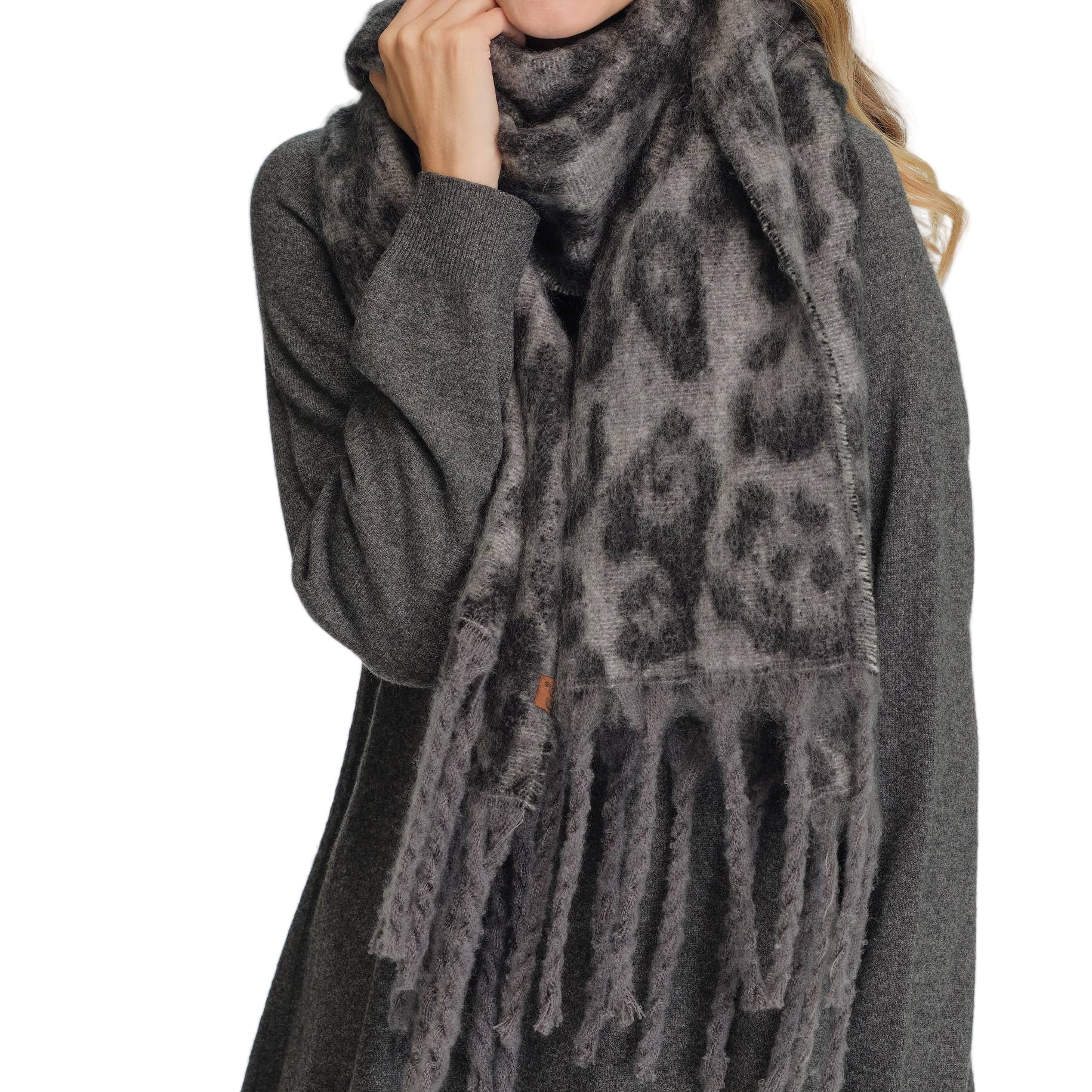 Leopard pattern fringe scarf, soft and stylish winter accessory.
