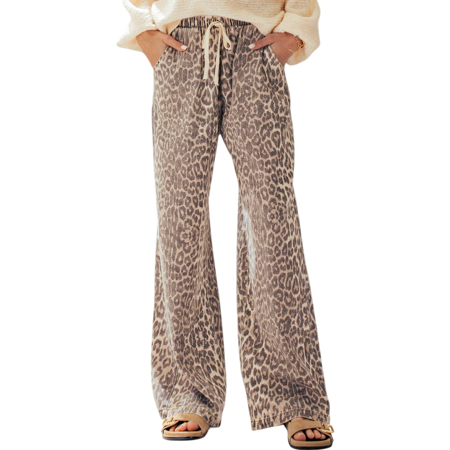 Leopard print pants worn by a person on a white background